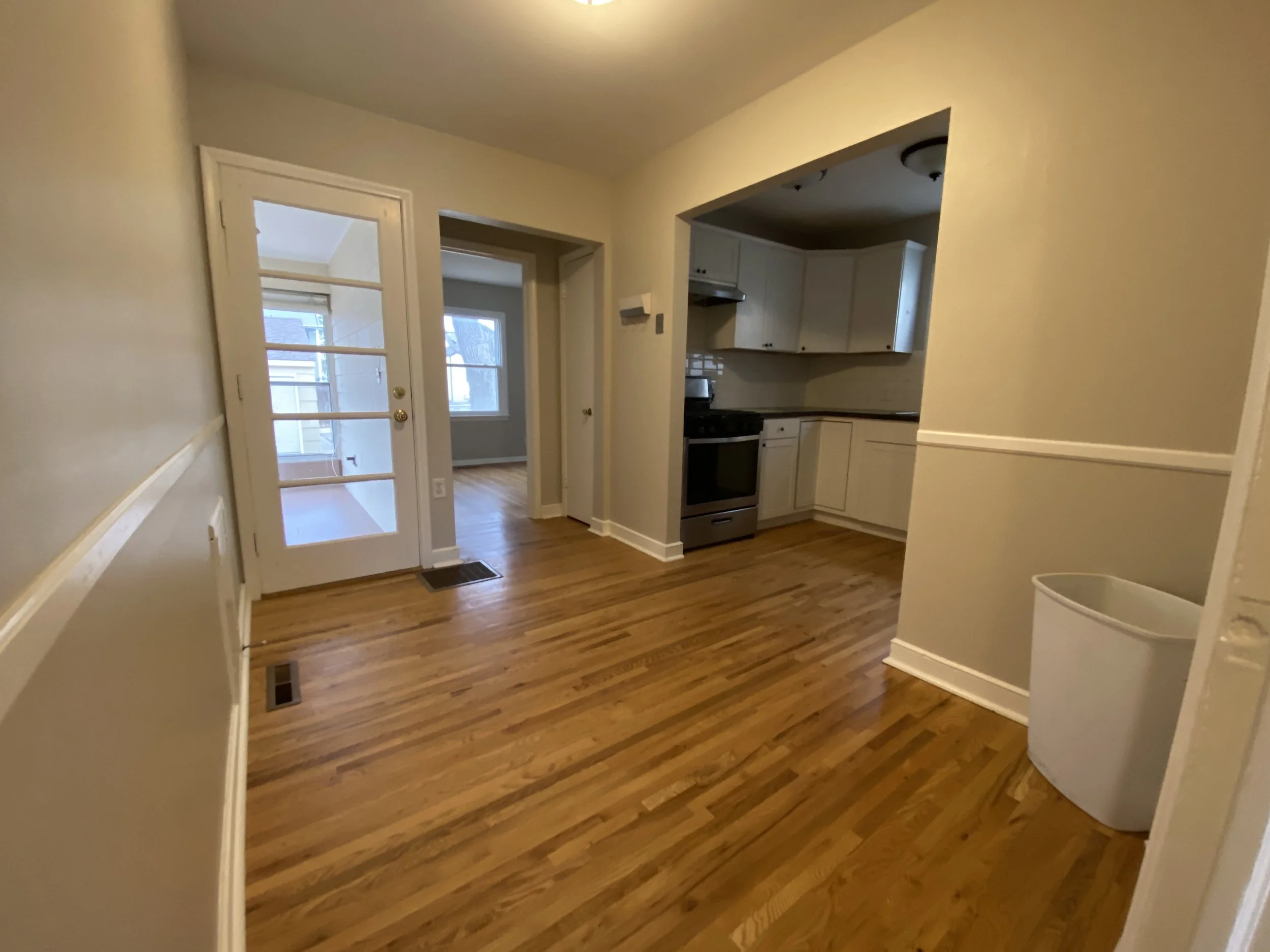 BEFORE: vacant dining room and kitchen in Saint Louis Park, MN