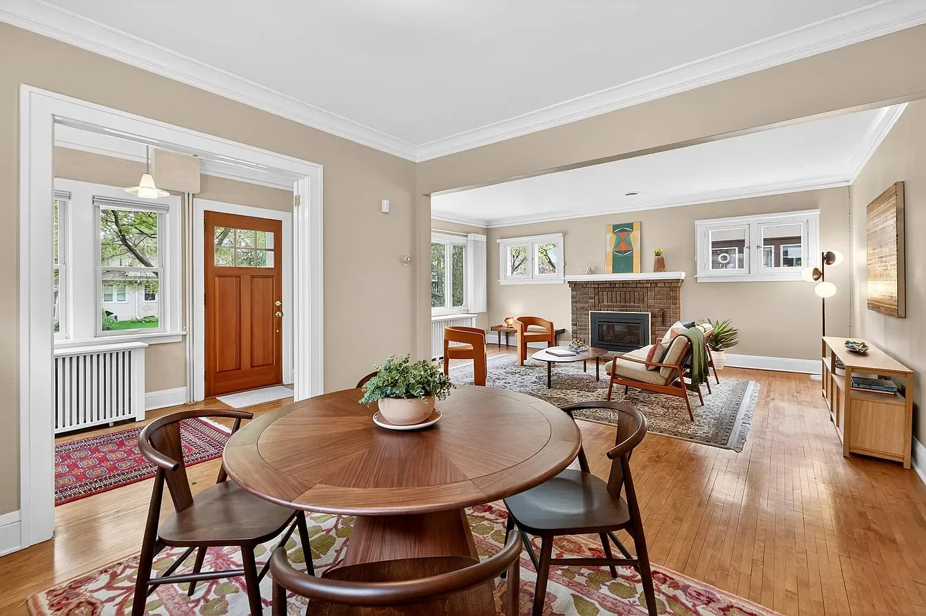 Staged main floor dining room, living room, and entry in historic 1920's Minneapolis home