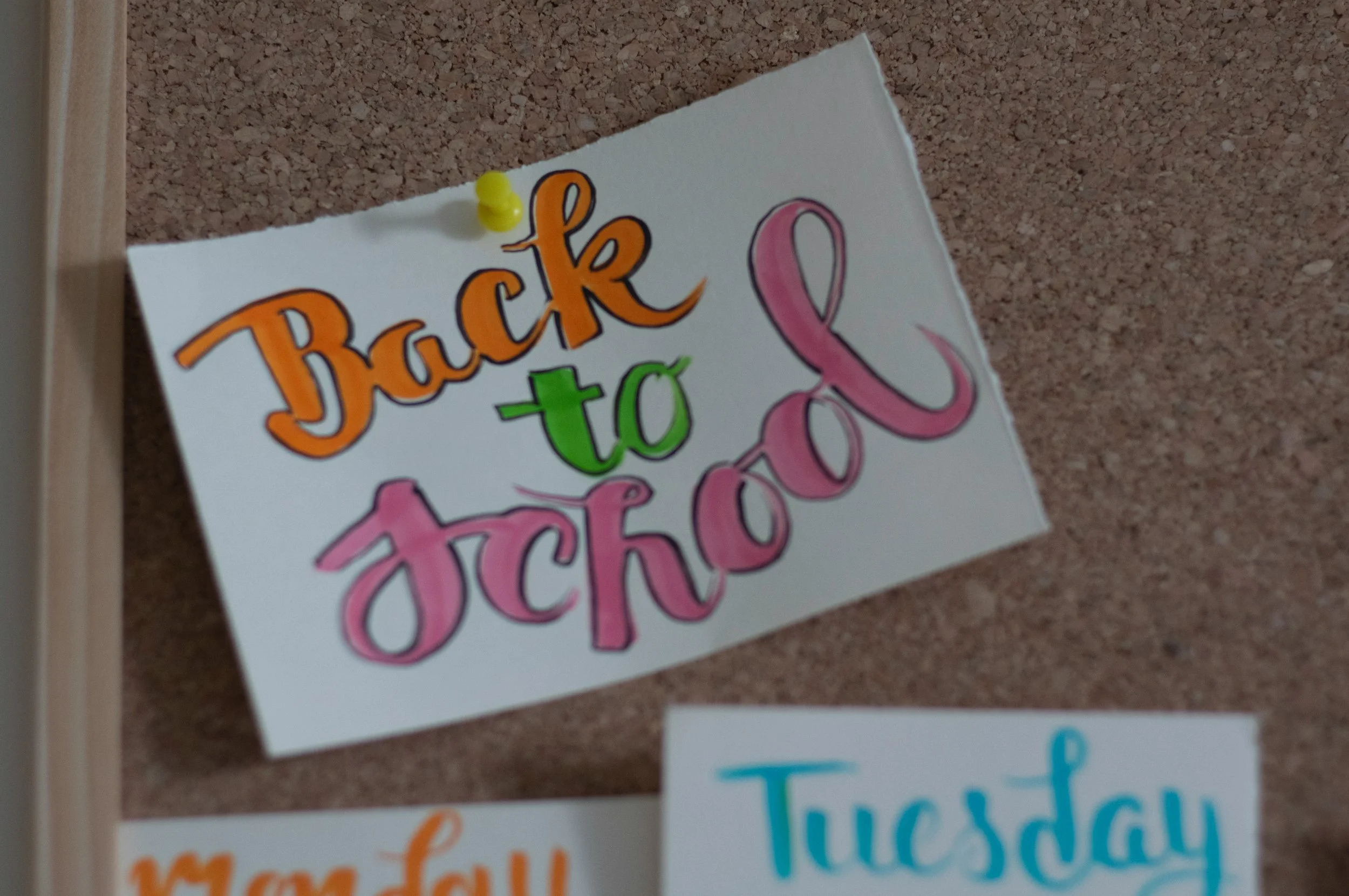 Back-to-school sign displayed on a classroom bulletin board