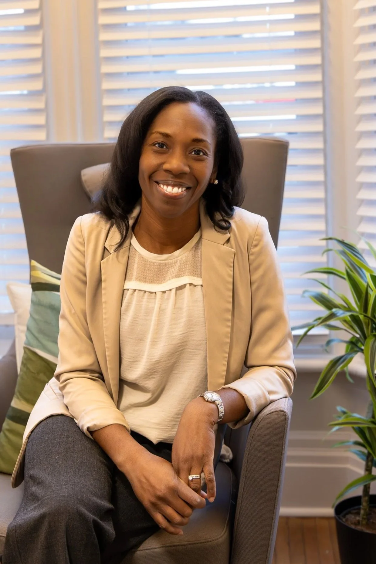 Photo of therapist Kristina Beifuss sitting in the office of Wintergreen Counselling Services in Cambridge Ontario.