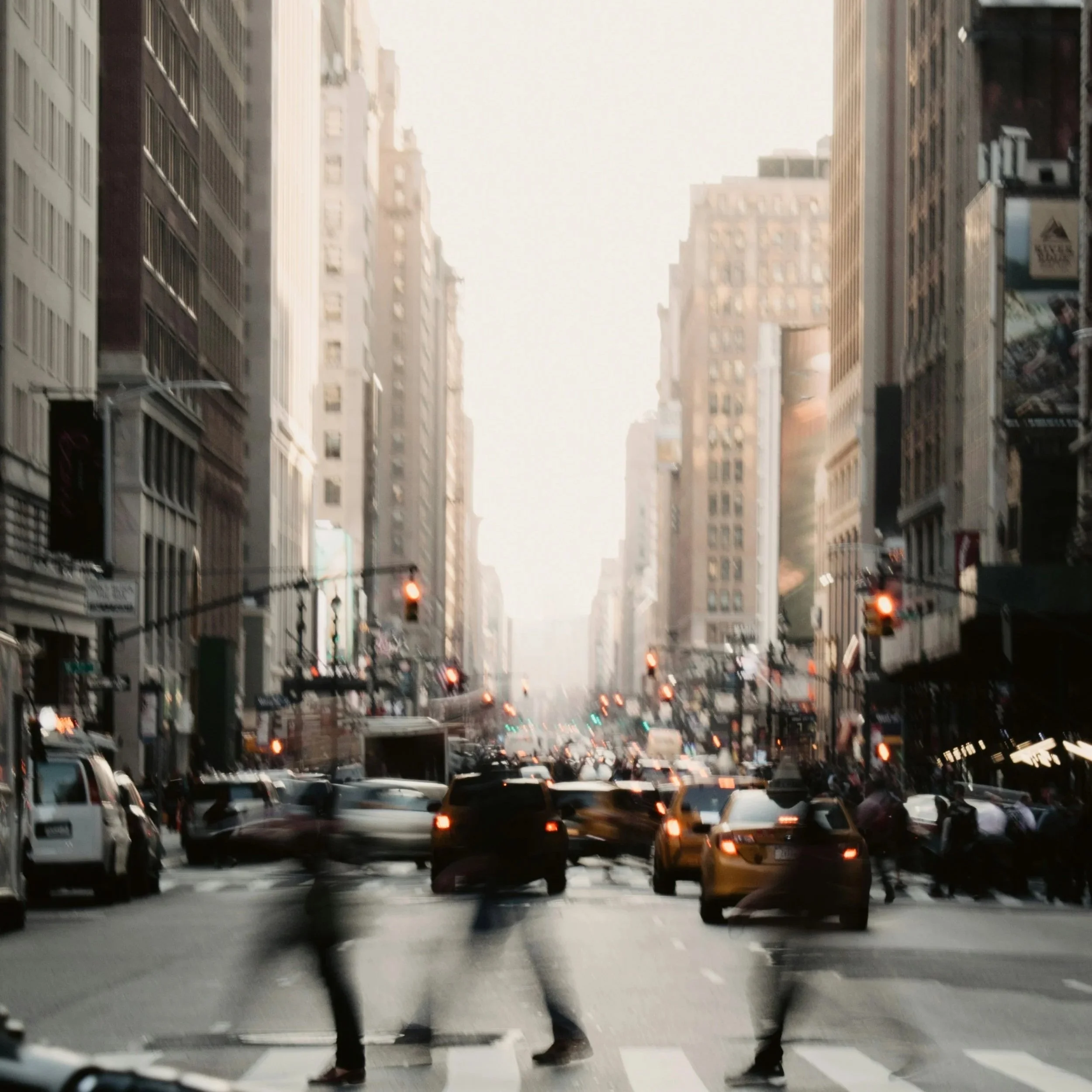 People walking through a busy city, illustrating the pace of modern life and the importance of creating a sustainable work–rest rhythm.