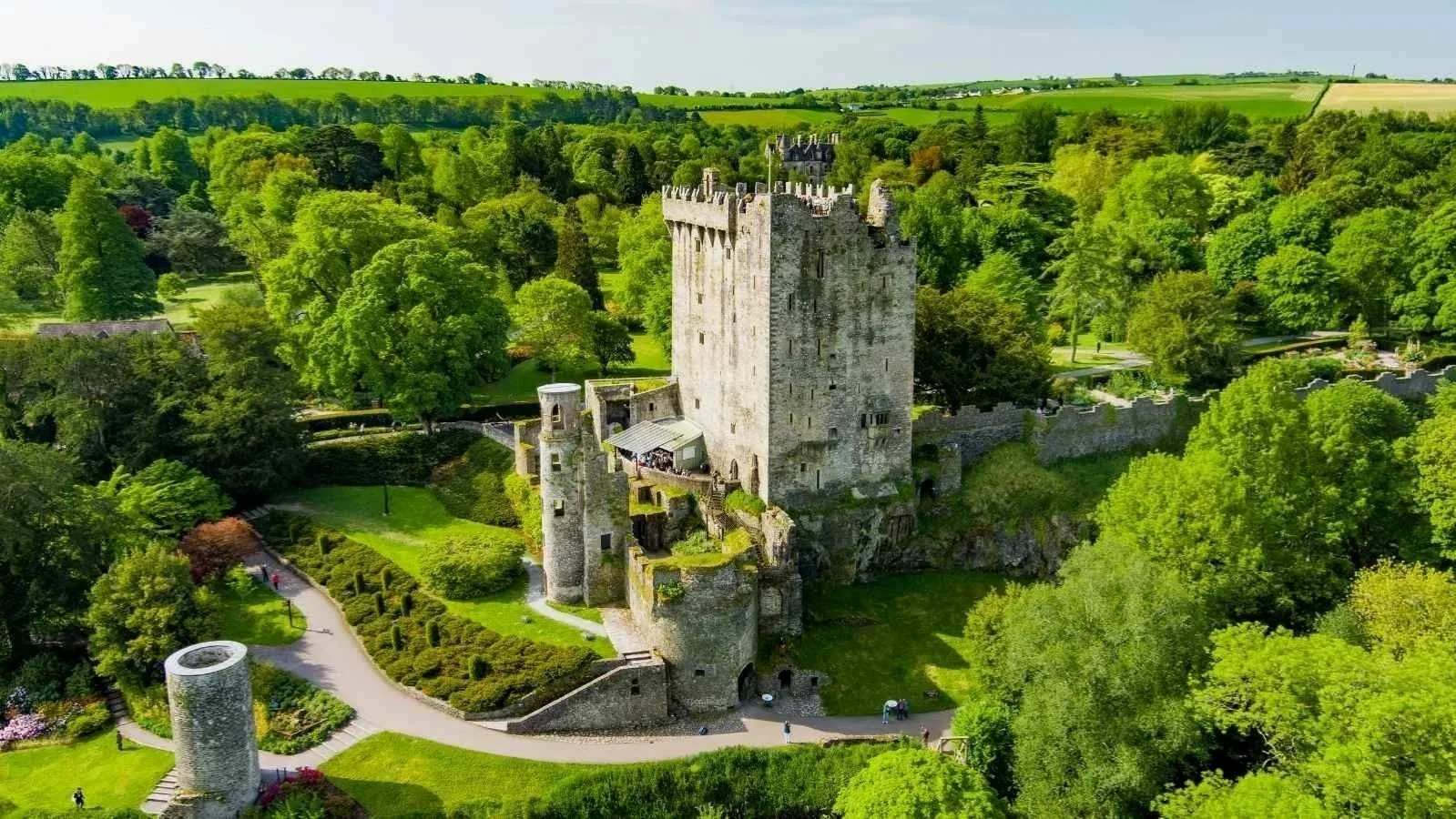 Blarney Castle surrounded by gardens and woodland in County Cork, a popular stop on private tours in the south of Ireland