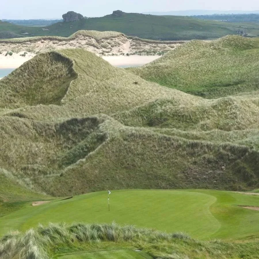 Links green surrounded by sand dunes at Tralee Golf Club, Kerry, Ireland