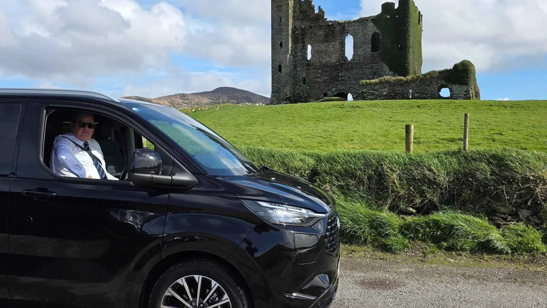 Brian in his premium vehicle visiting one of the many stops on his signature skellig coastal tour