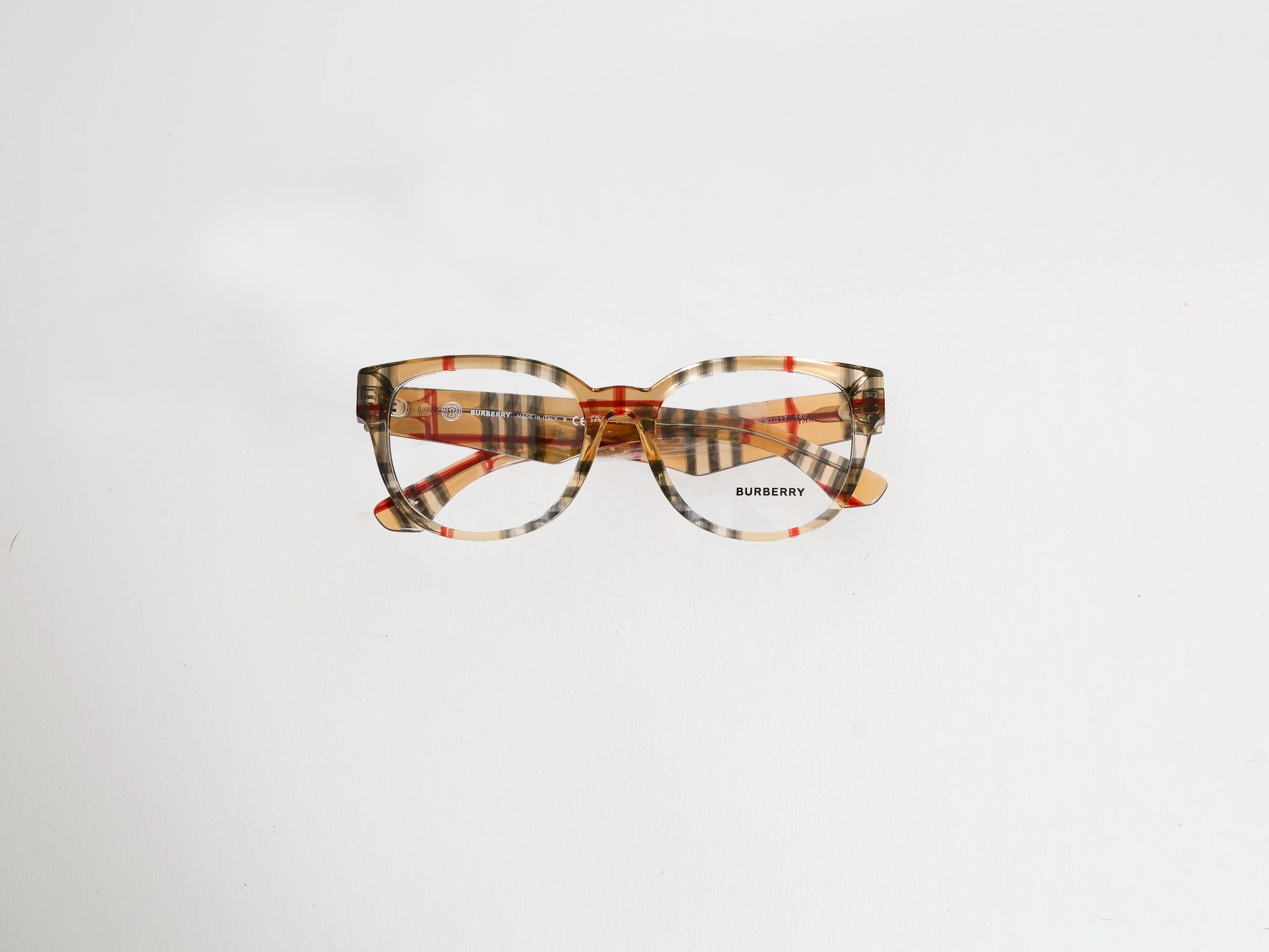 Tortoise shell-patterned Burberry eyeglasses on a white background.