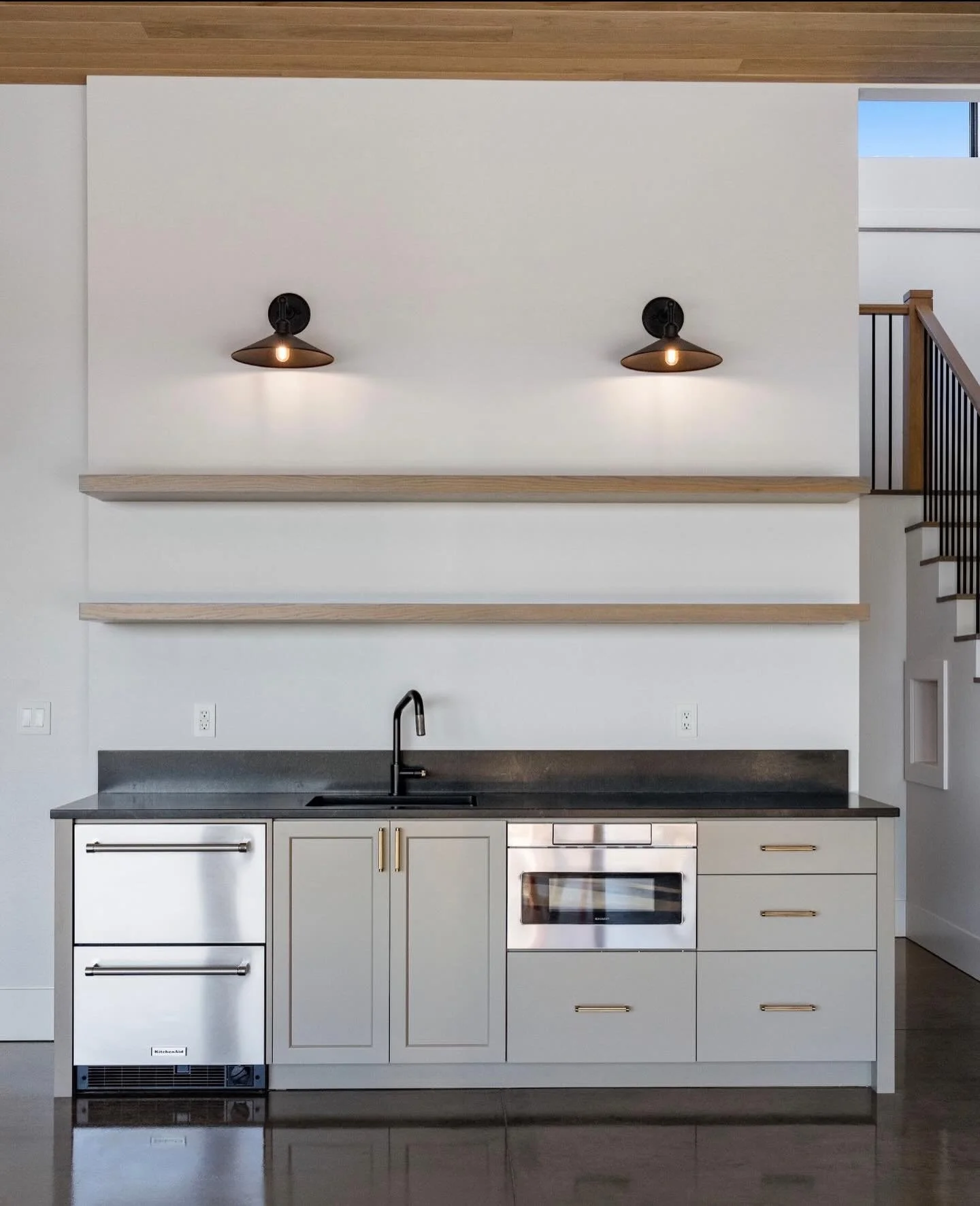 Snacks, drinks and a few less steps to the kitchen. This basement boasts a generous entertaining space, complete with this small refreshment center.