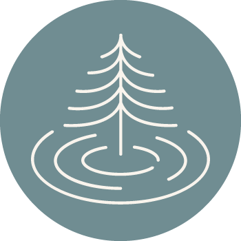 A cream-colored tree and ripples of water in a green circle