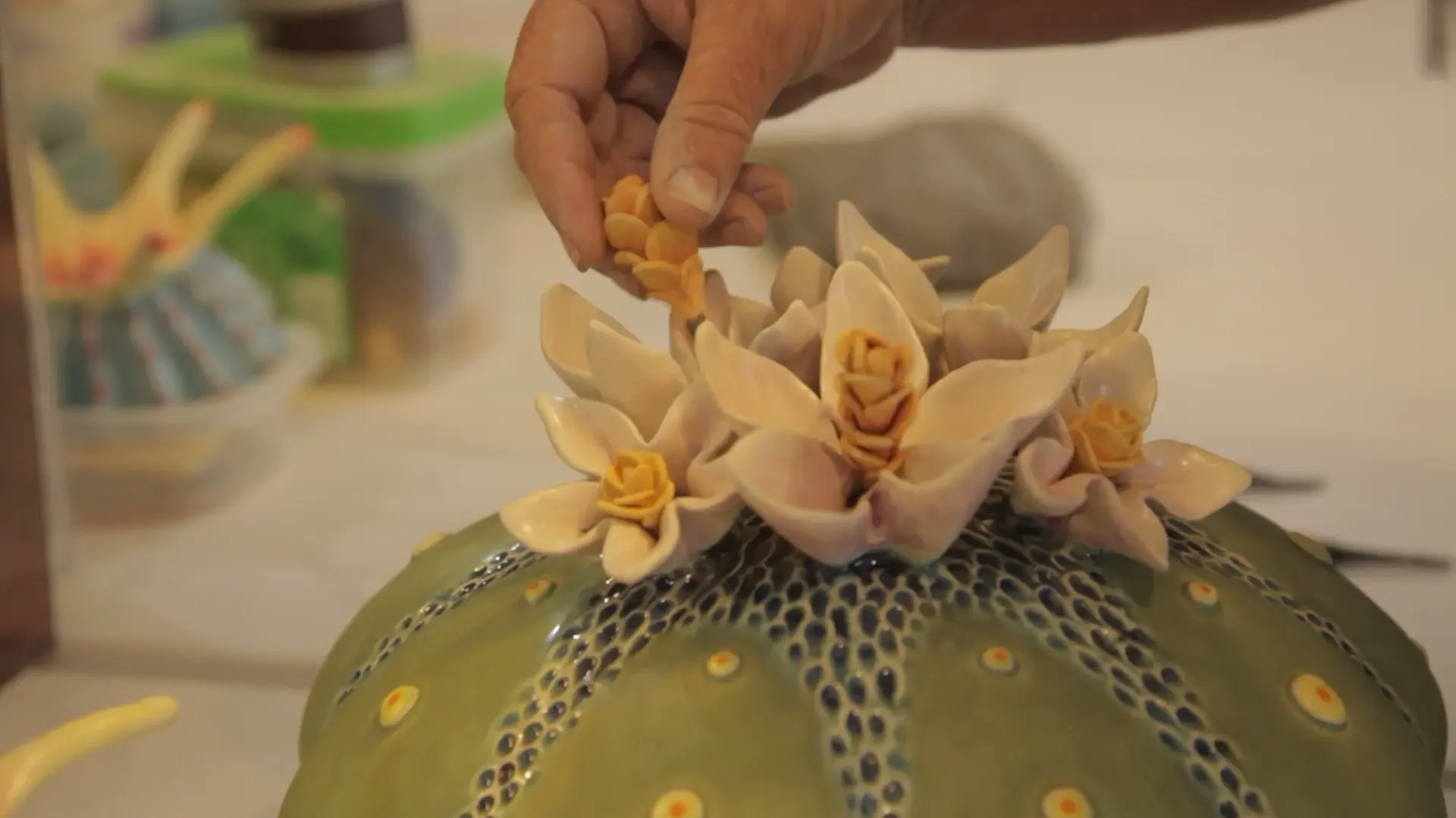 Beth Garcia showcasing the detail of her sculptures