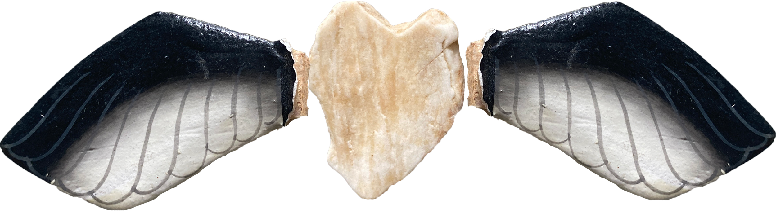 Heart shaped rock with two wooden wings