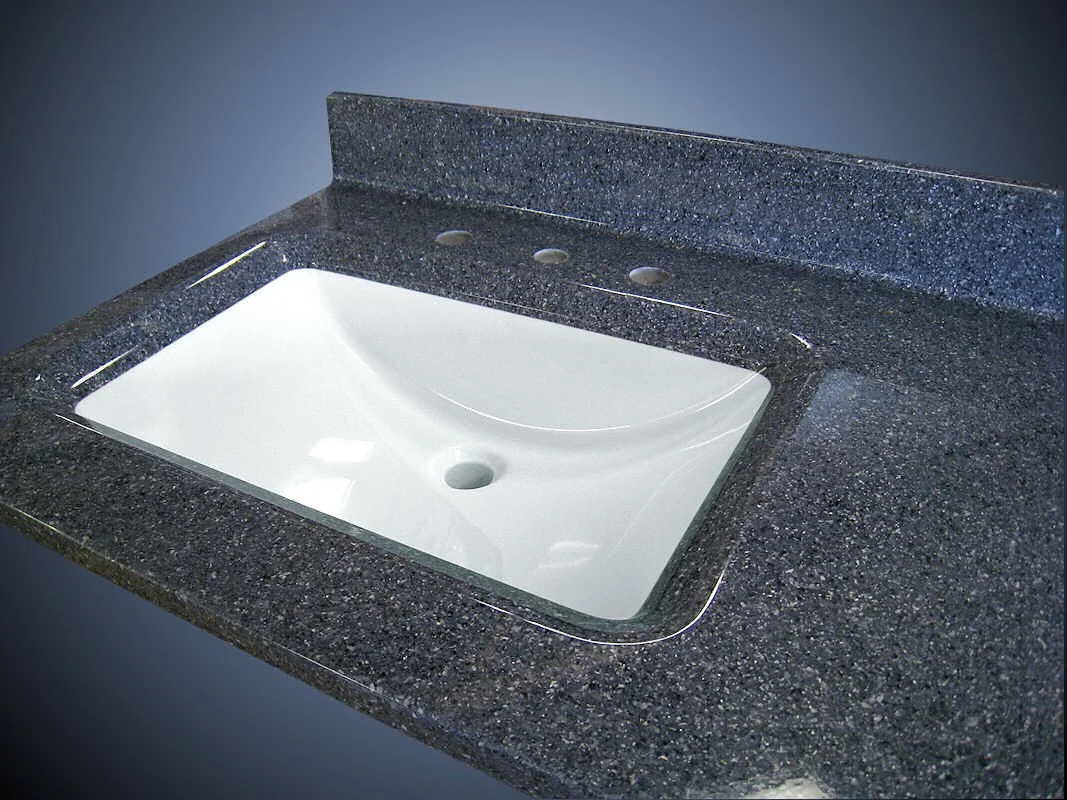 Bathroom vanity countertop installation with undermount sink and solid surface surround