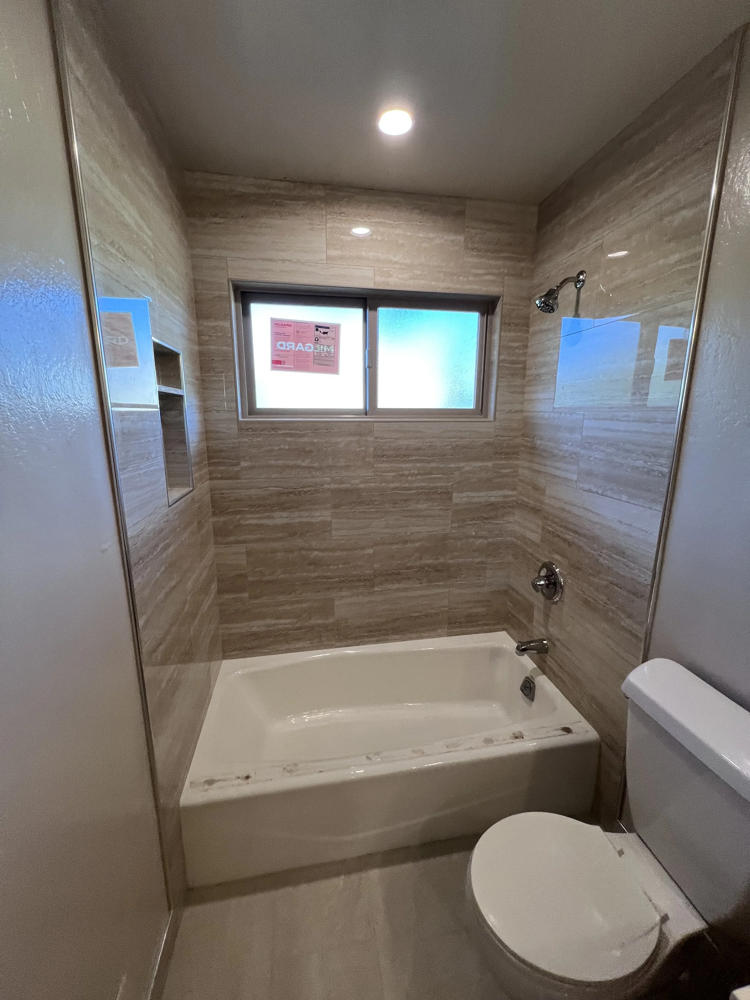 Simple and elegant tub-shower remodel for rental units