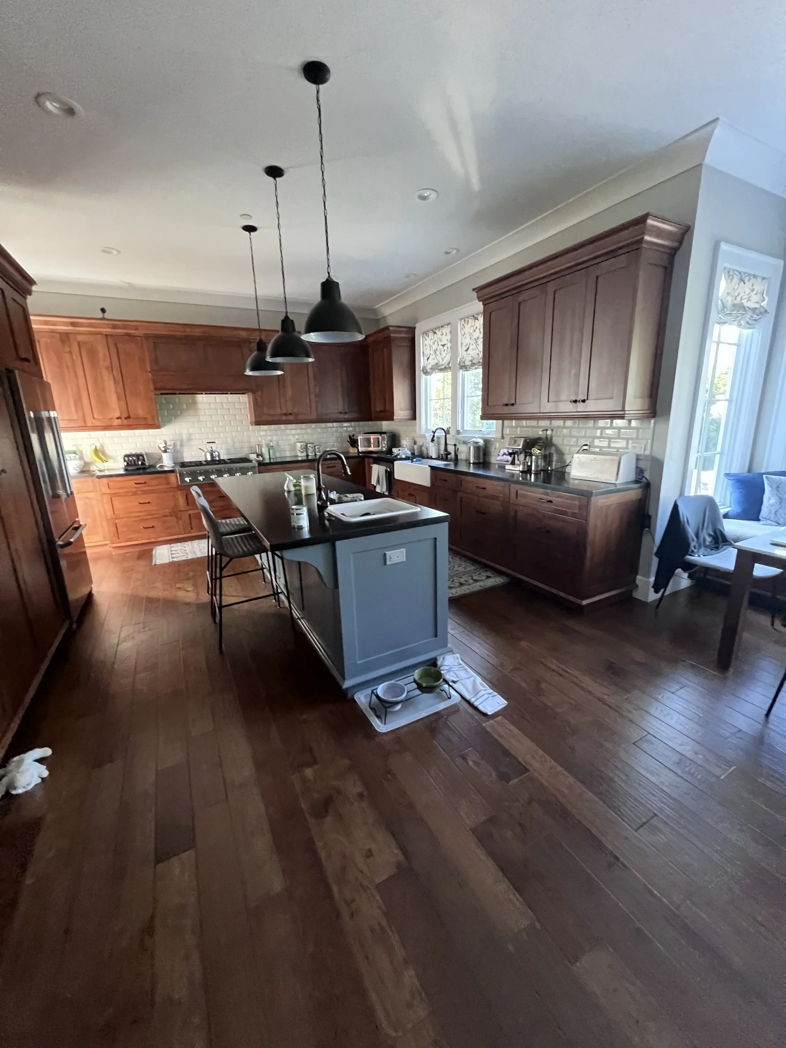 Before: Original Kitchen with dated finishes 