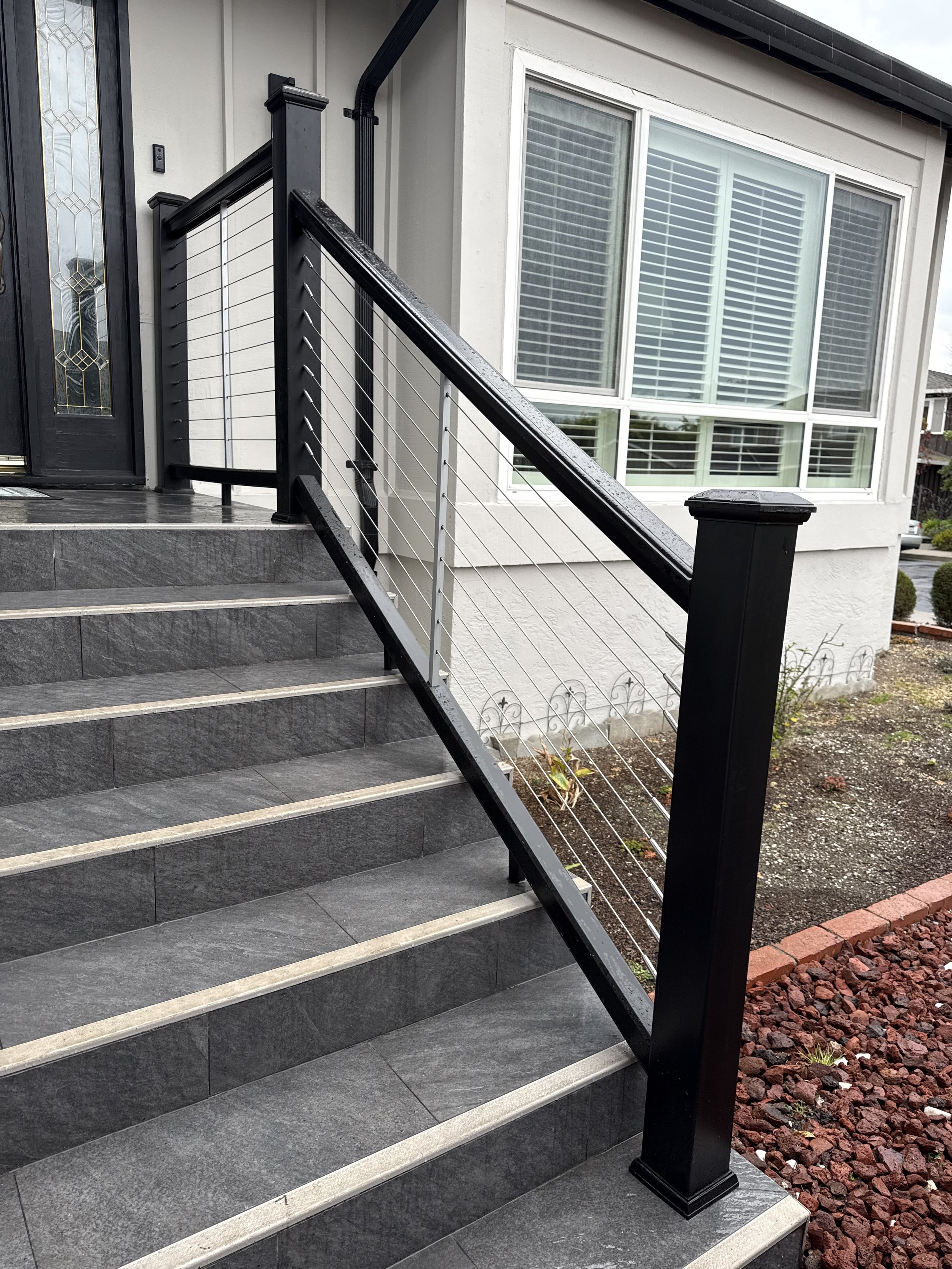 New tiled entry steps with reinforced framing and custom TimberTech railings