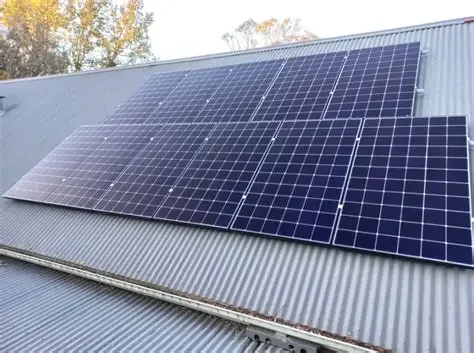Solar panels installed on a corrugated metal roof.