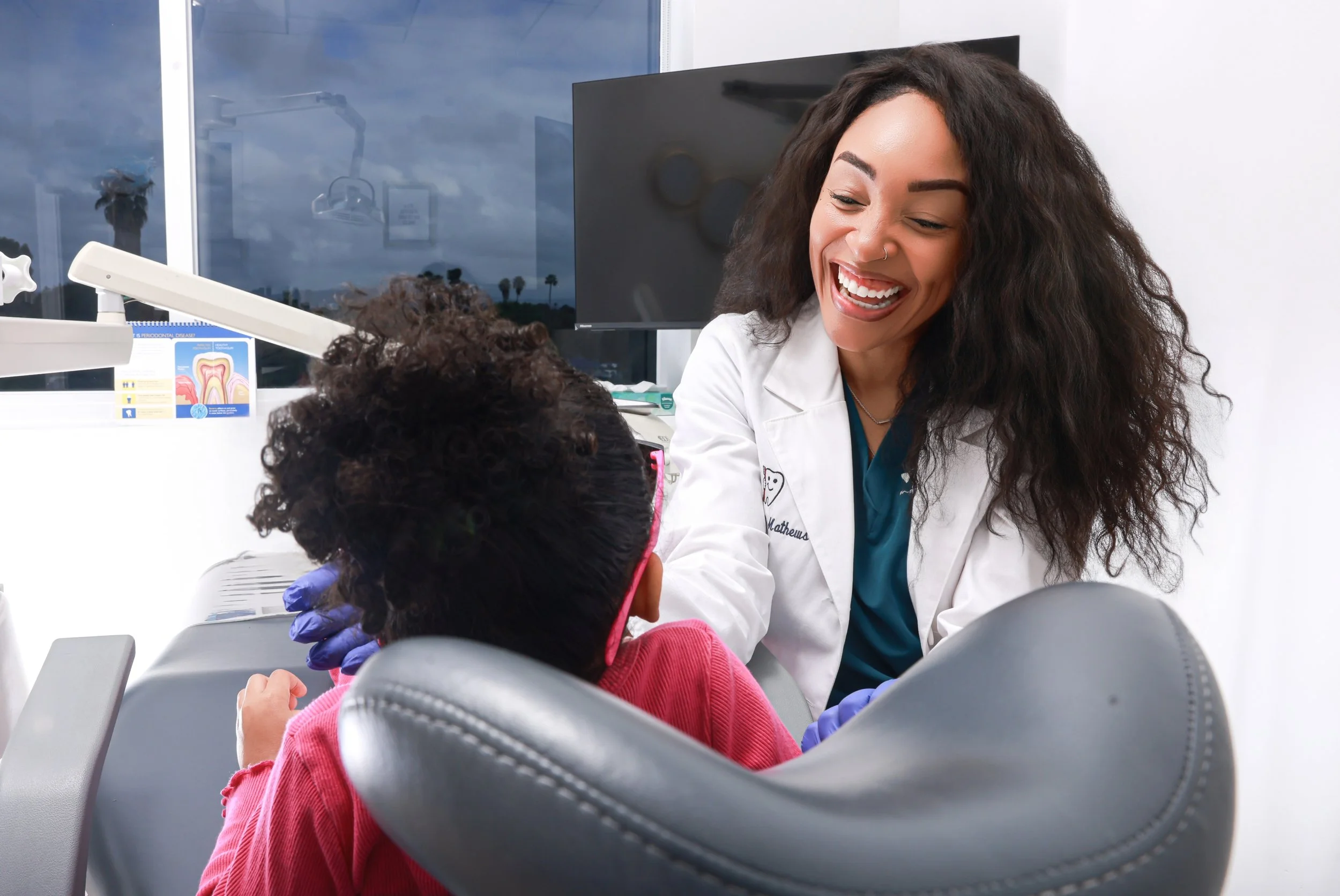Dr. Mathews-Bryant with Child Patient