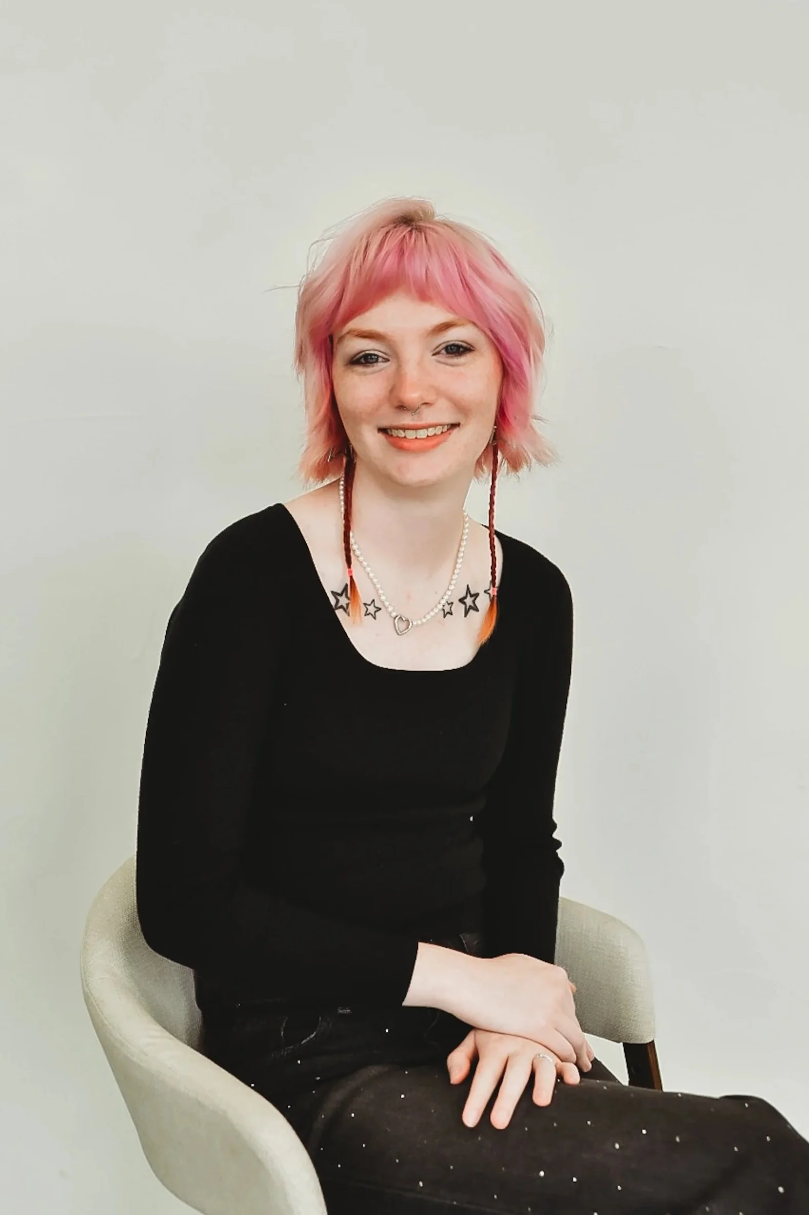 Zoe, stylist at Sage and Mane Mebane. Zoe specializes in vivid hair color, alt and emo hair cuts.