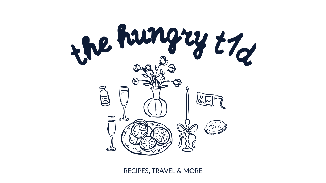 A logo with the words 'the hungry tud' and illustrations of a flower vase, two glasses of sparkling drink, a candy, a plate of cookies, a candle holder, a small flag, and a pie, with the subtitle 'RECIPES, TRAVEL & MORE'.