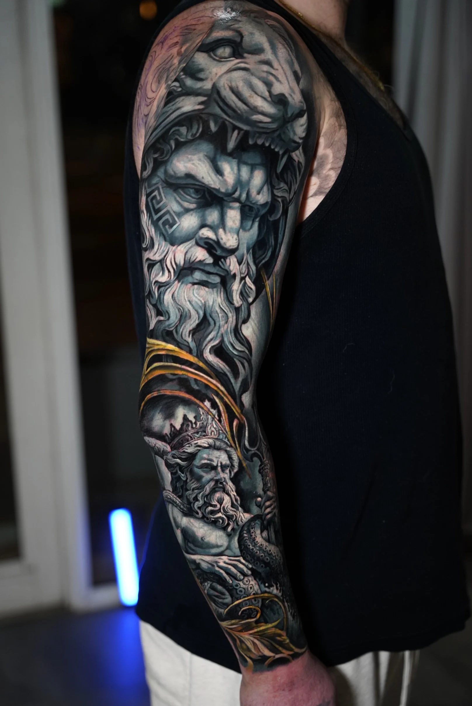 Large-scale black and grey realism sleeve inspired by classical sculpture.

This piece was built using a layered cover-up process to achieve strong contrast, depth, and long-term readability, while fully integrating the design with the natural flow o