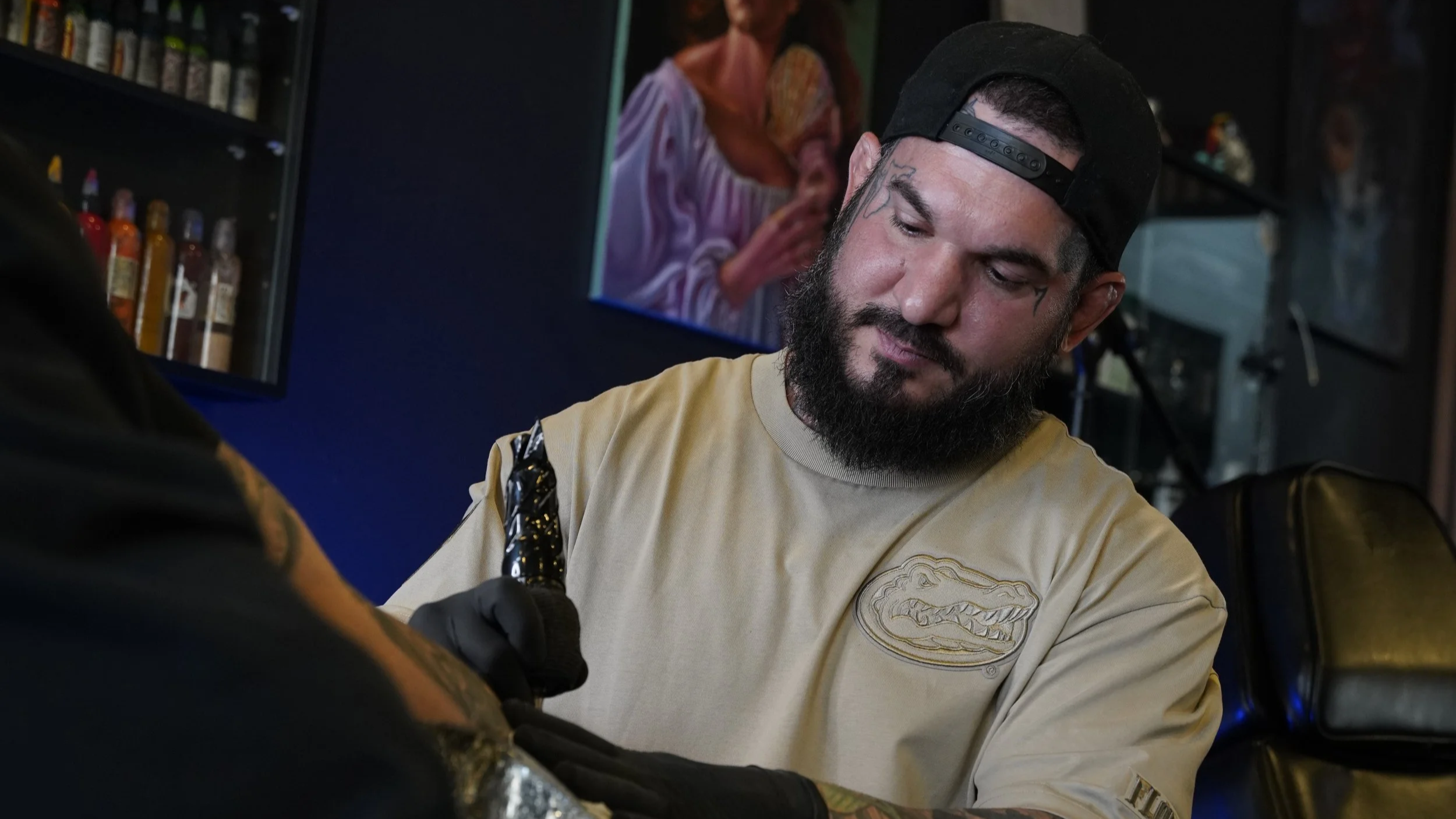 Adrian Aguirre, neo-traditional tattoo artist, working at Black Nova Tattoo Collective in Miami.