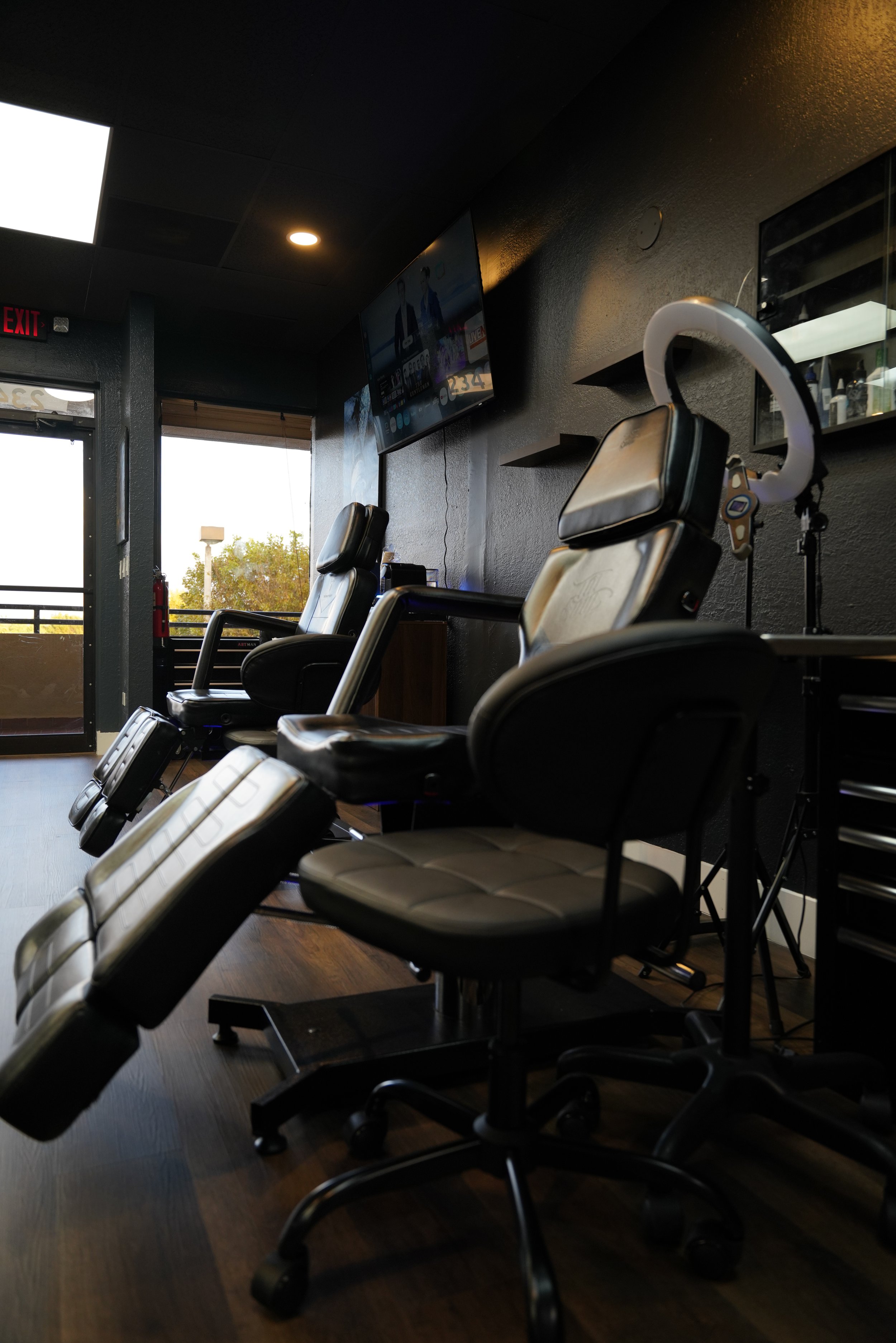 Professional tattoo workstations at Black Nova Tattoo Collective in Miami featuring premium tattoo chairs, artist stations, and a clean, modern studio designed for comfort and precision.