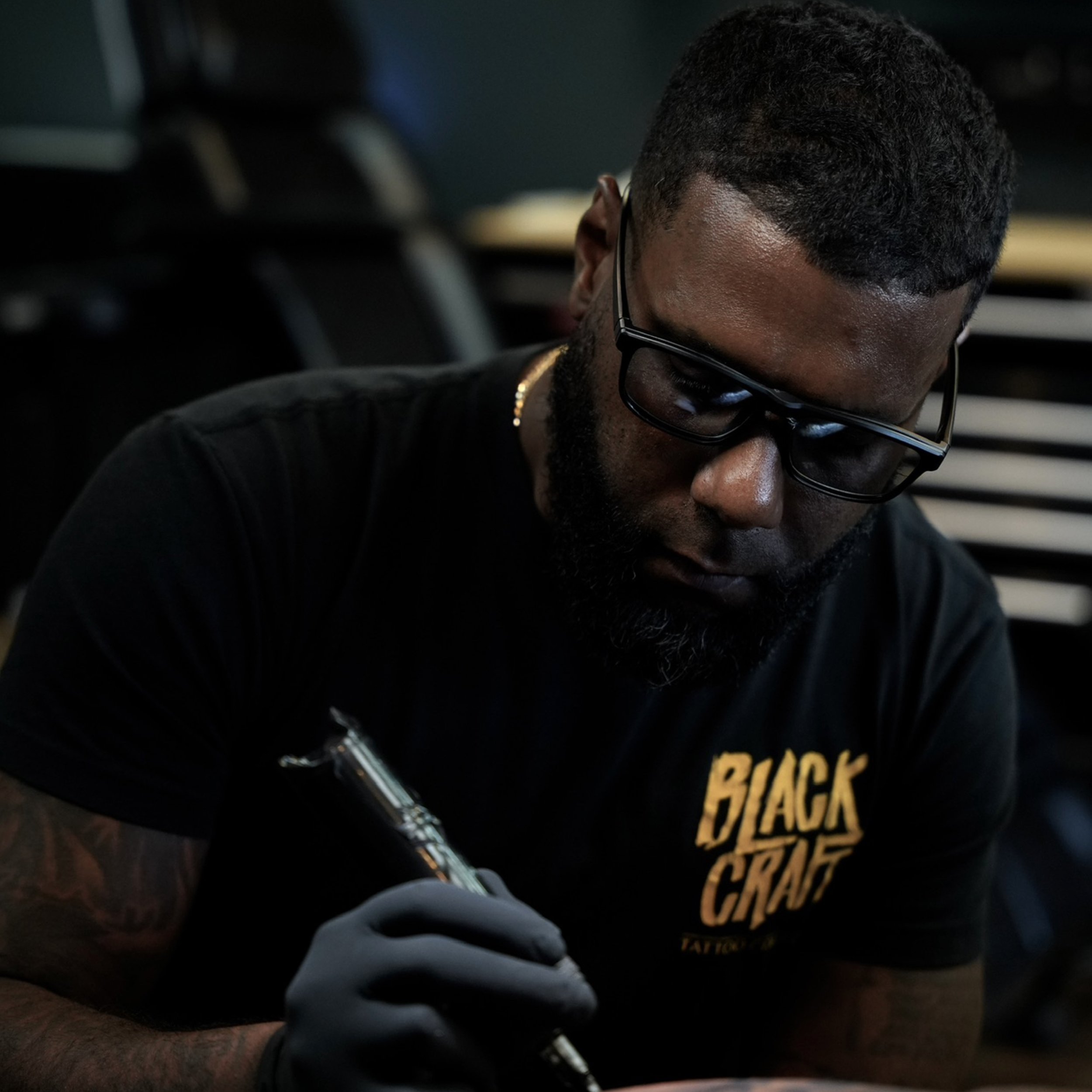 Luis Dajer tattooing a client at Black Nova Tattoo Collective in Miami.