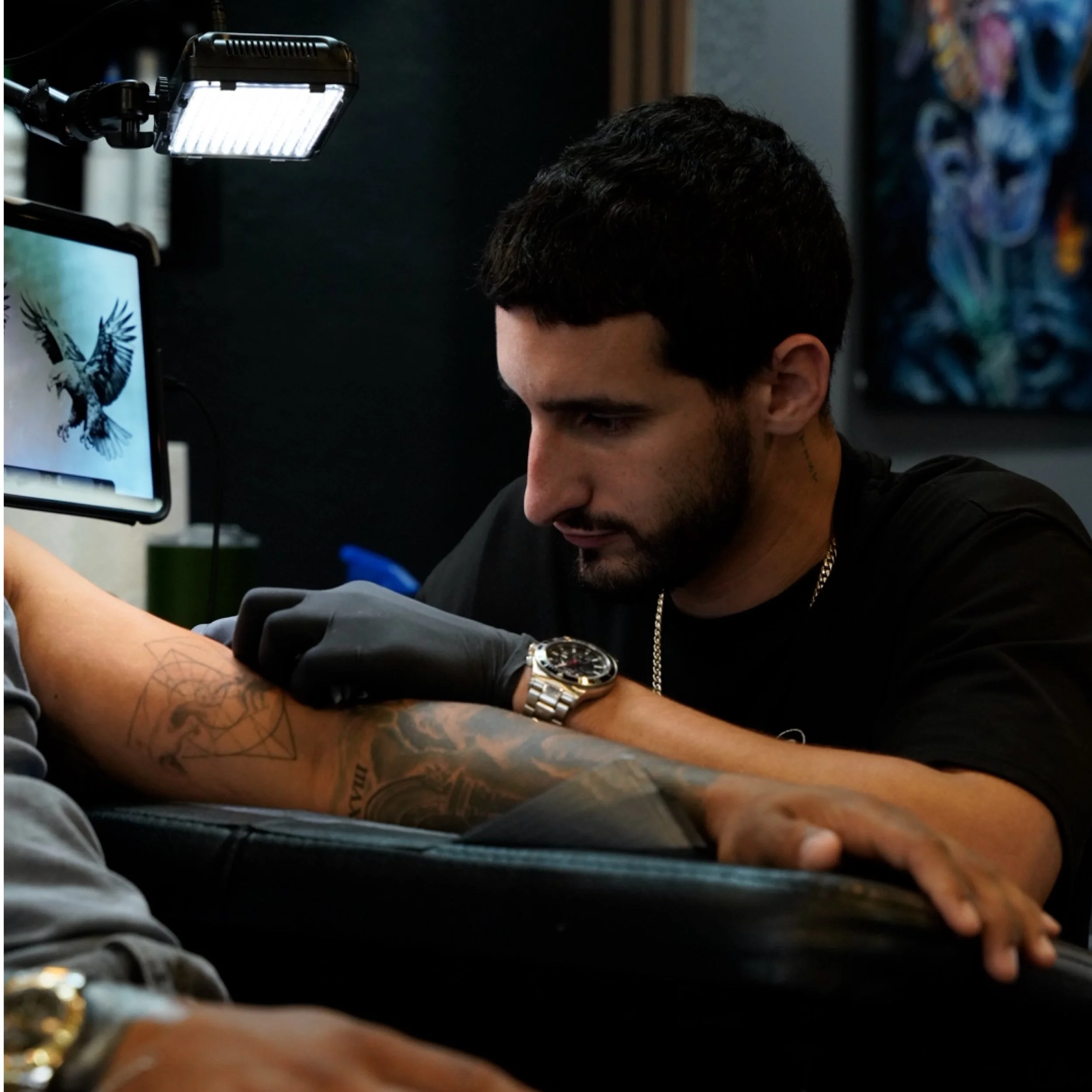 Sandy working with a client at Black Nova Tattoo Collective in Miami.