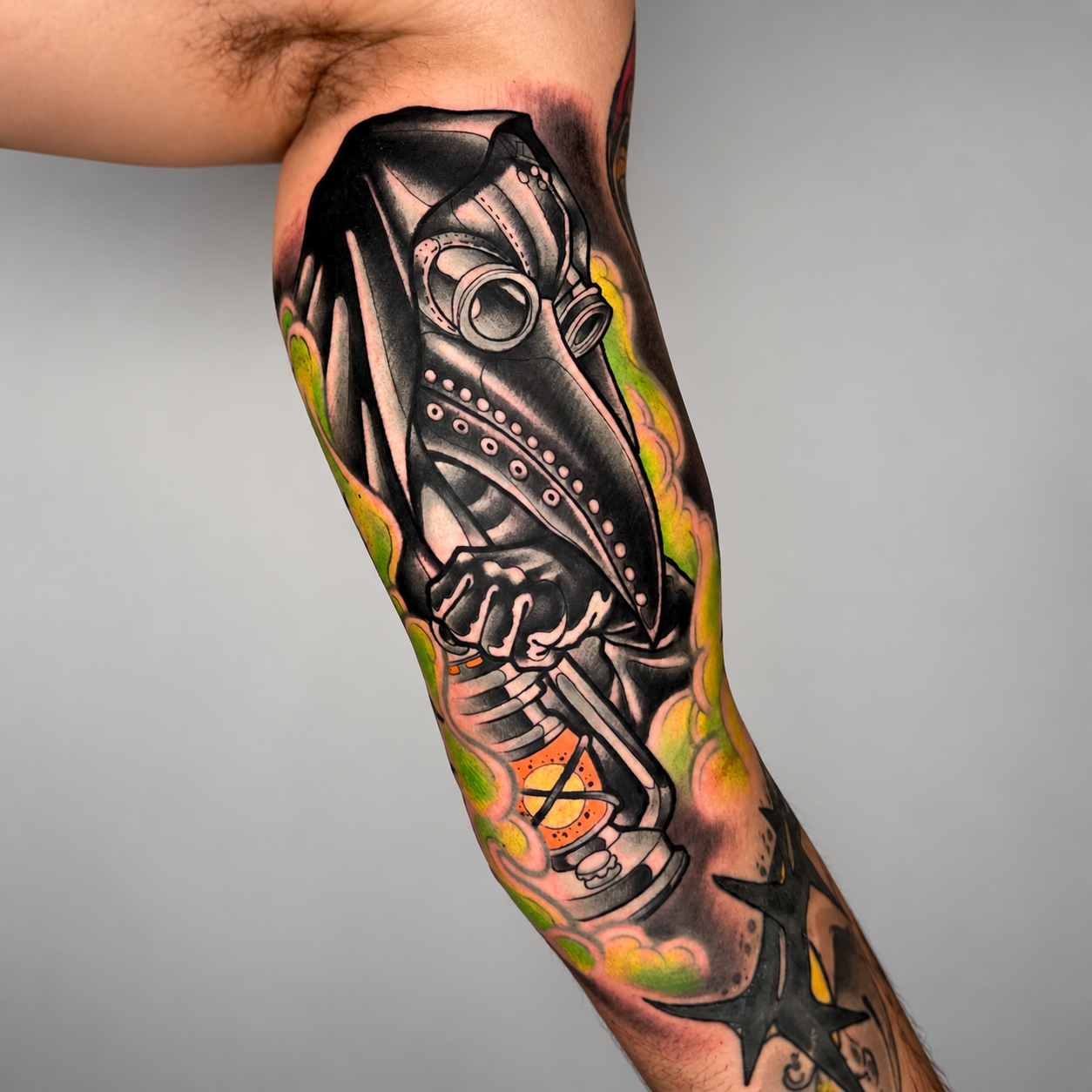 Detailed biomechanical arm tattoo by Adrian Aguirre.