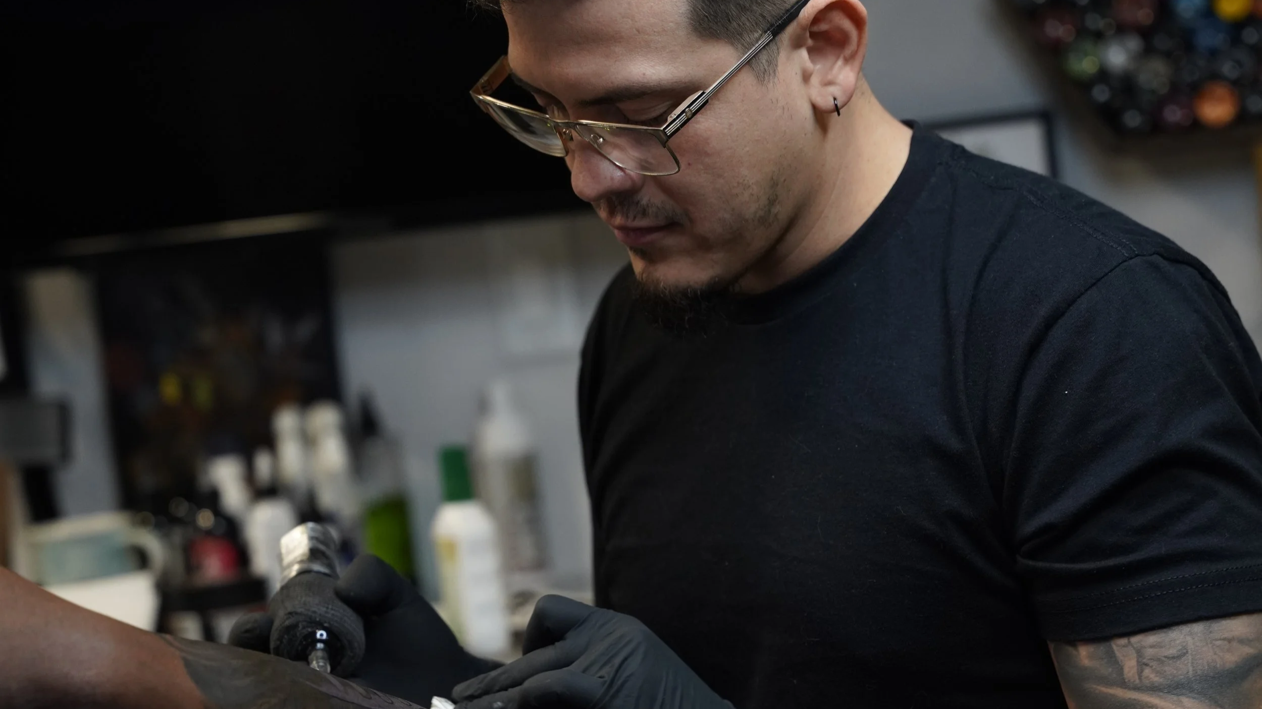Alexis Torres tattoo artist working at Black Nova Tattoo Collective in Miami, specializing in black and gray and color realism tattoos.