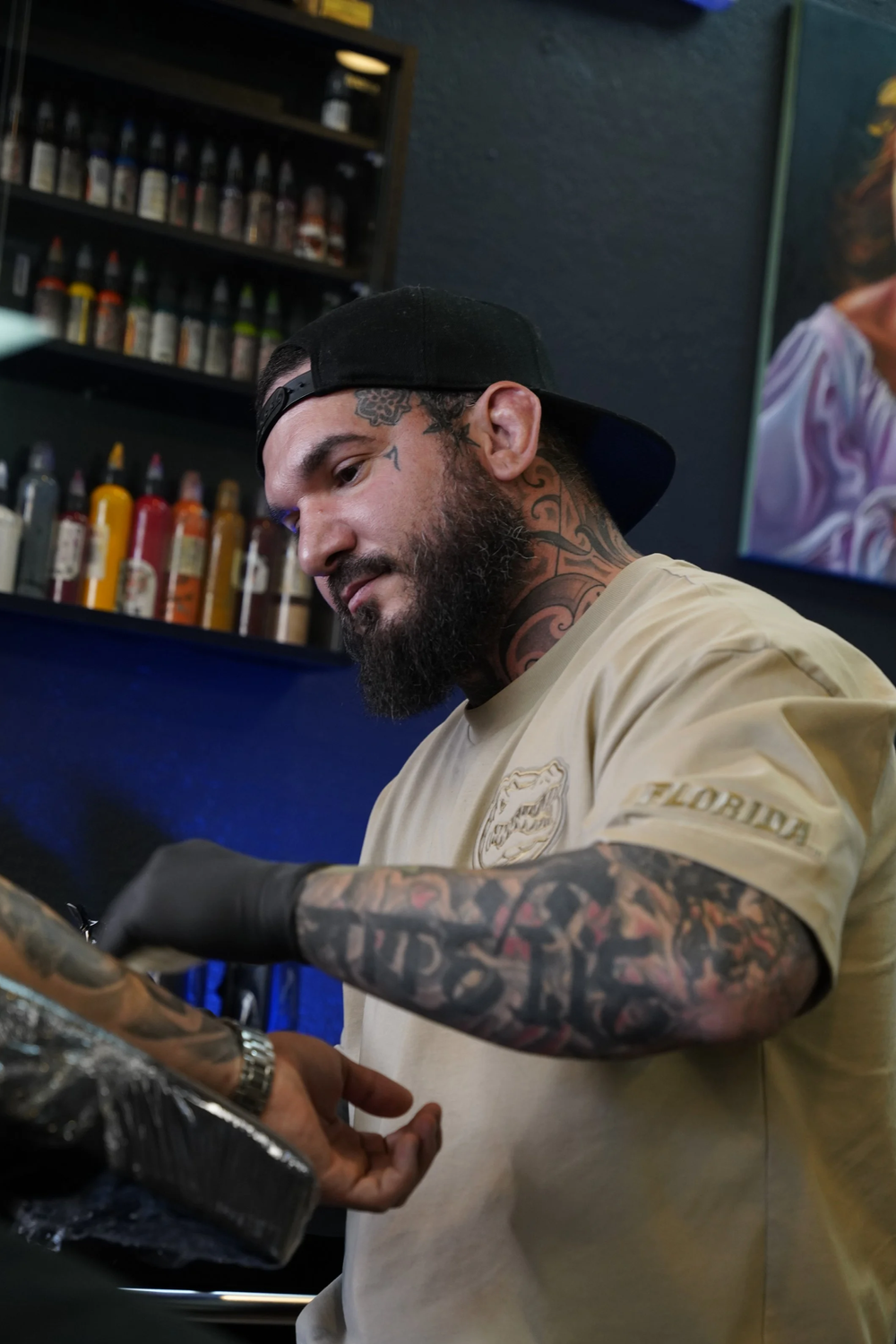 Adrian Aguirre working at Black Nova Tattoo Collective.