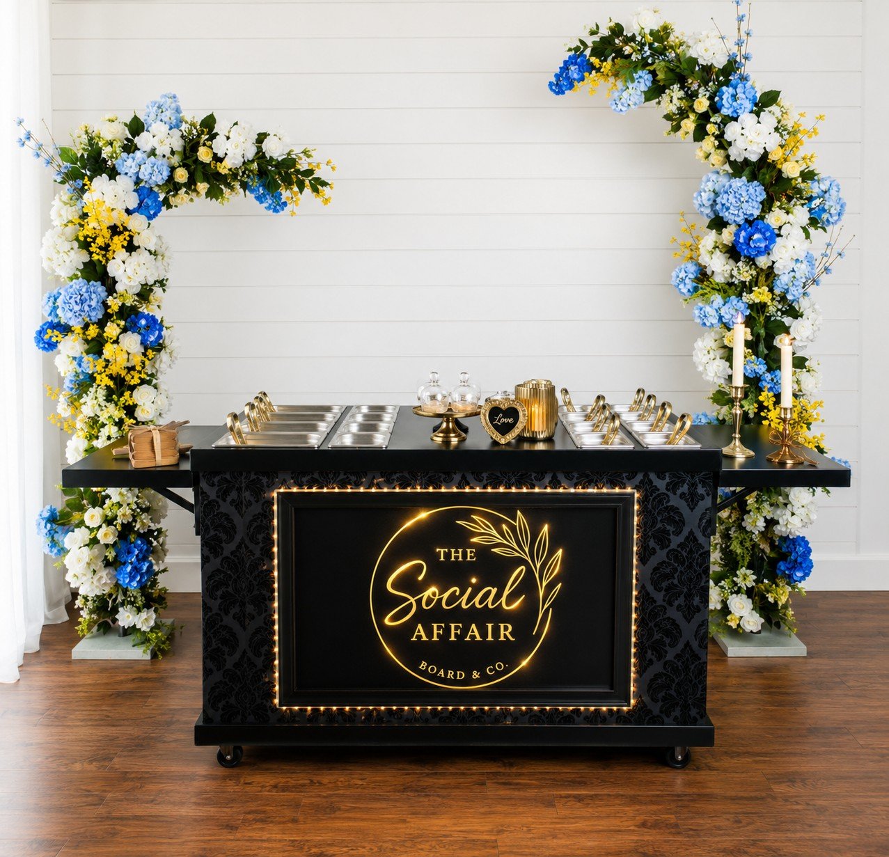 Cart with floral arch in background.jpg