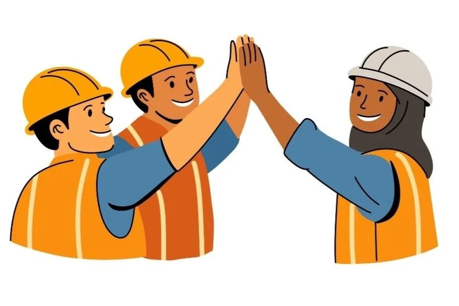 Four construction workers wearing yellow and white hard hats and orange safety vests giving each other high fives.
