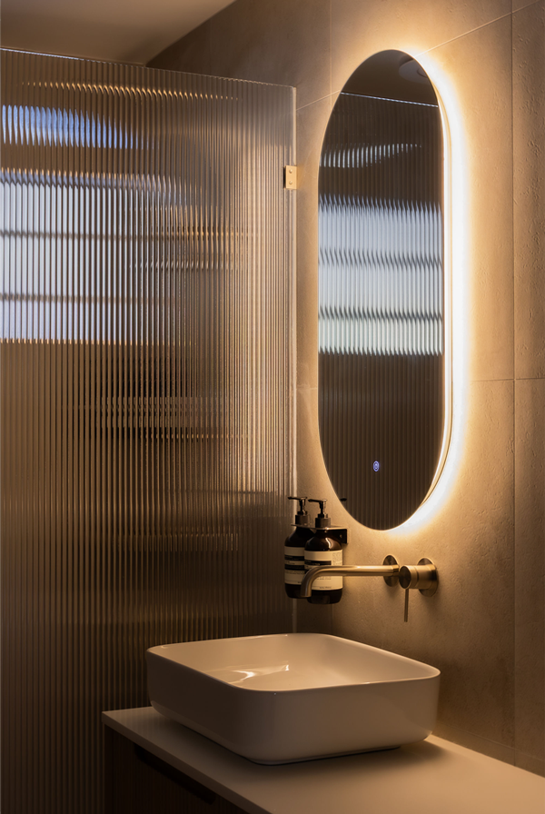 Timber detailing, fluted glass, bespoke joinery, functional design.