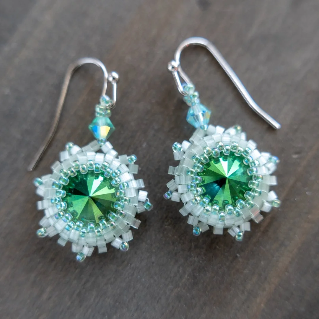 Earlier this week, I got together with my Aunt and wanted to make her a little something for Mother's Day. So I made these bezeled rivoli earrings in her favorite color. 

I bezeled a 12mm rivoli crystal with size 11 cylinder Miyuki and size 15 seed 