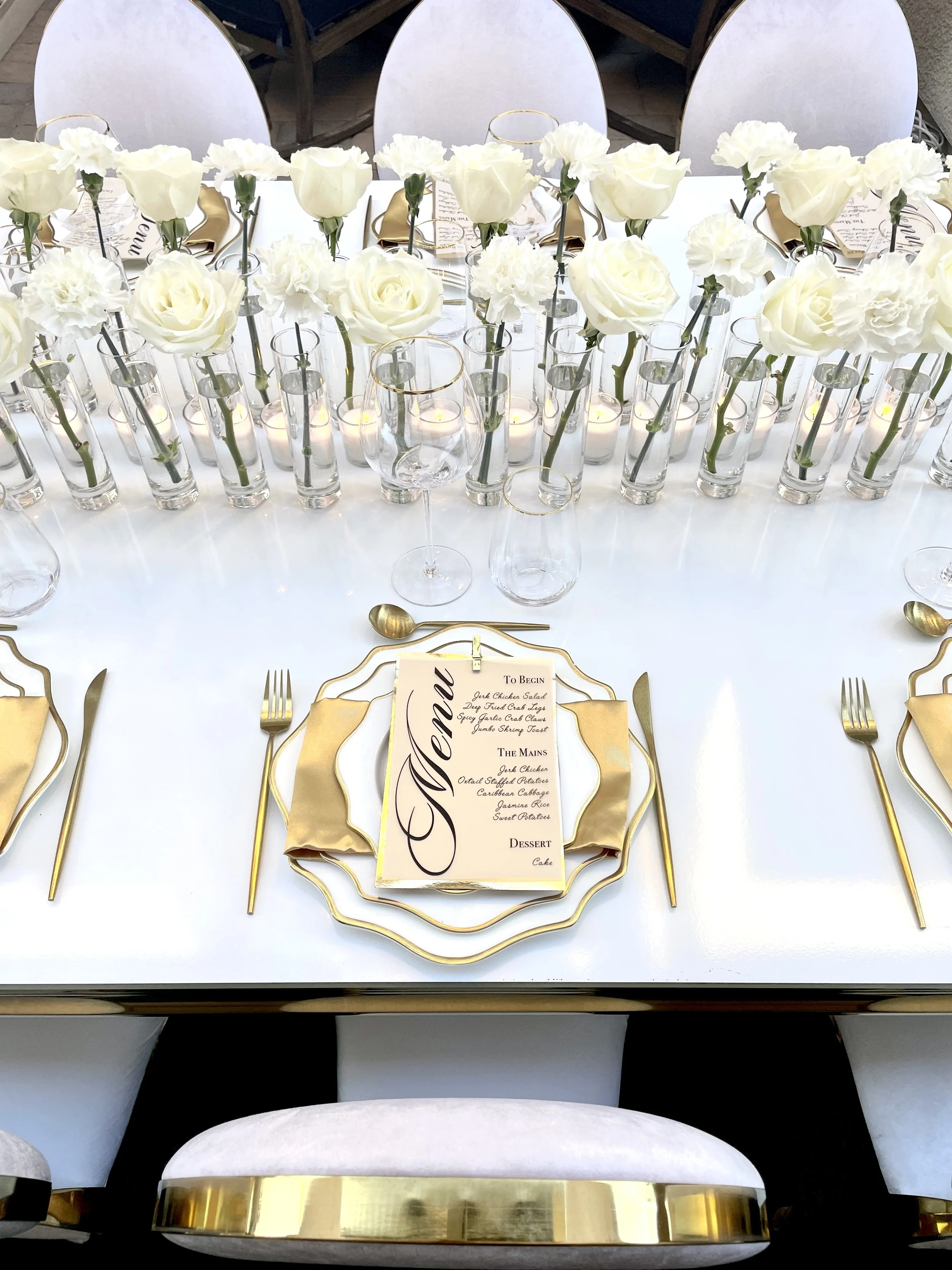 Luxury birthday table setup with elegant white florals and gold accents designed by Marie Events in Las Vegas.