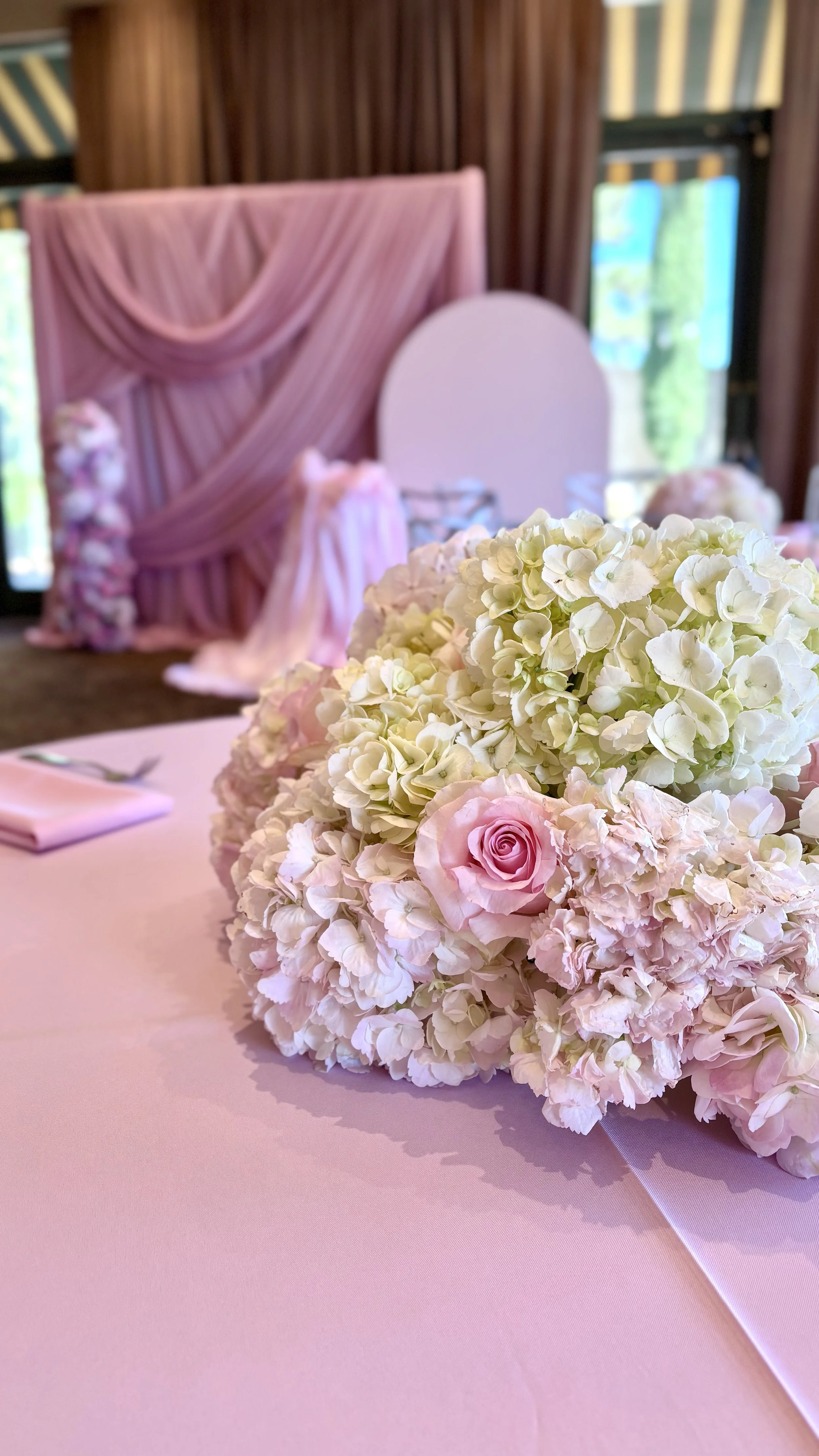 Luxury floral centerpiece with blush roses and white hydrangeas designed by Marie Events for an elegant celebration in Las Vegas.