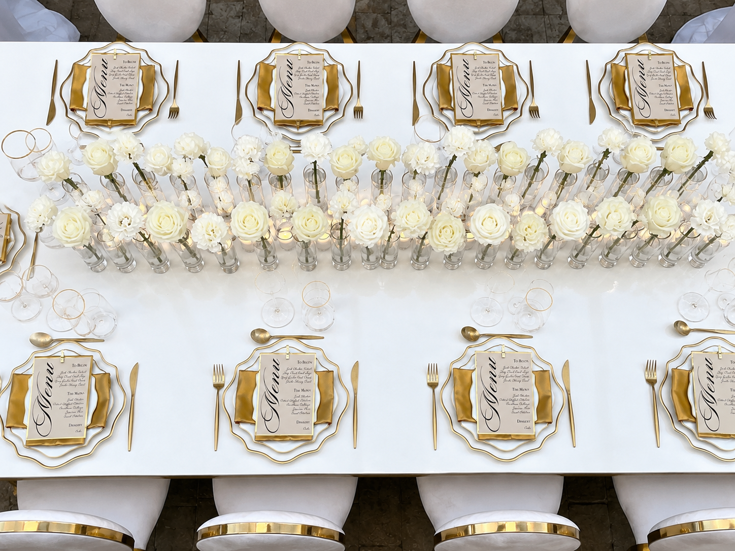 Luxury tablescape featuring elegant white floral centerpieces and custom place settings designed by Marie Events for a celebration in Las Vegas.