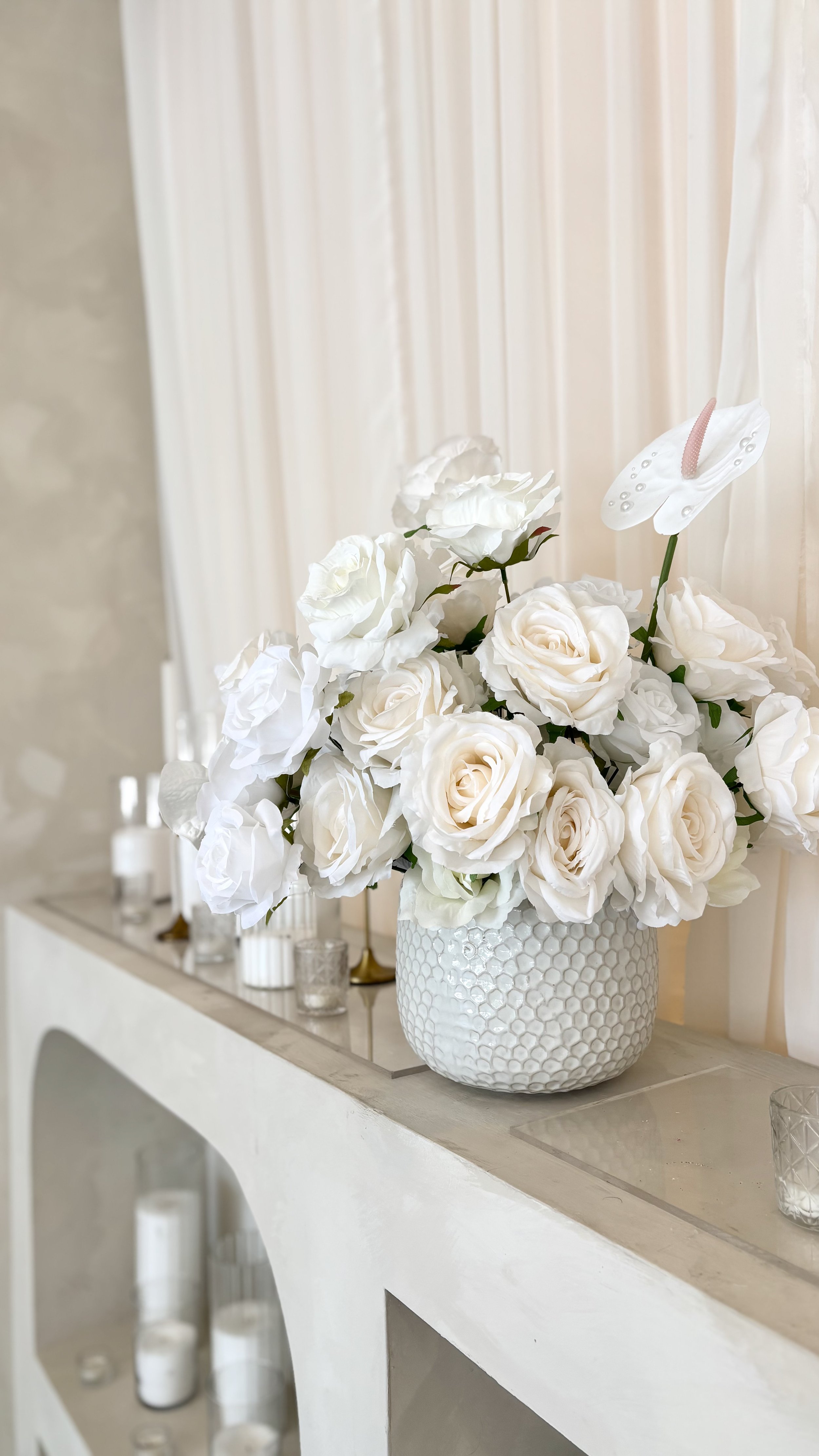 Luxury white floral arrangement and wedding table décor designed by Marie Events in Las Vegas.
