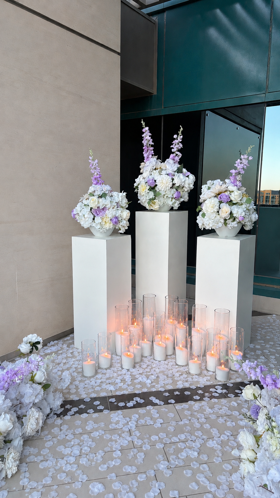 Floral arrangement on pedestal with floral runner and candles for a beautiful and elegant proposal