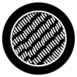 Close-up of a round, textured black and white grill or cooking surface with a diagonal striped pattern.