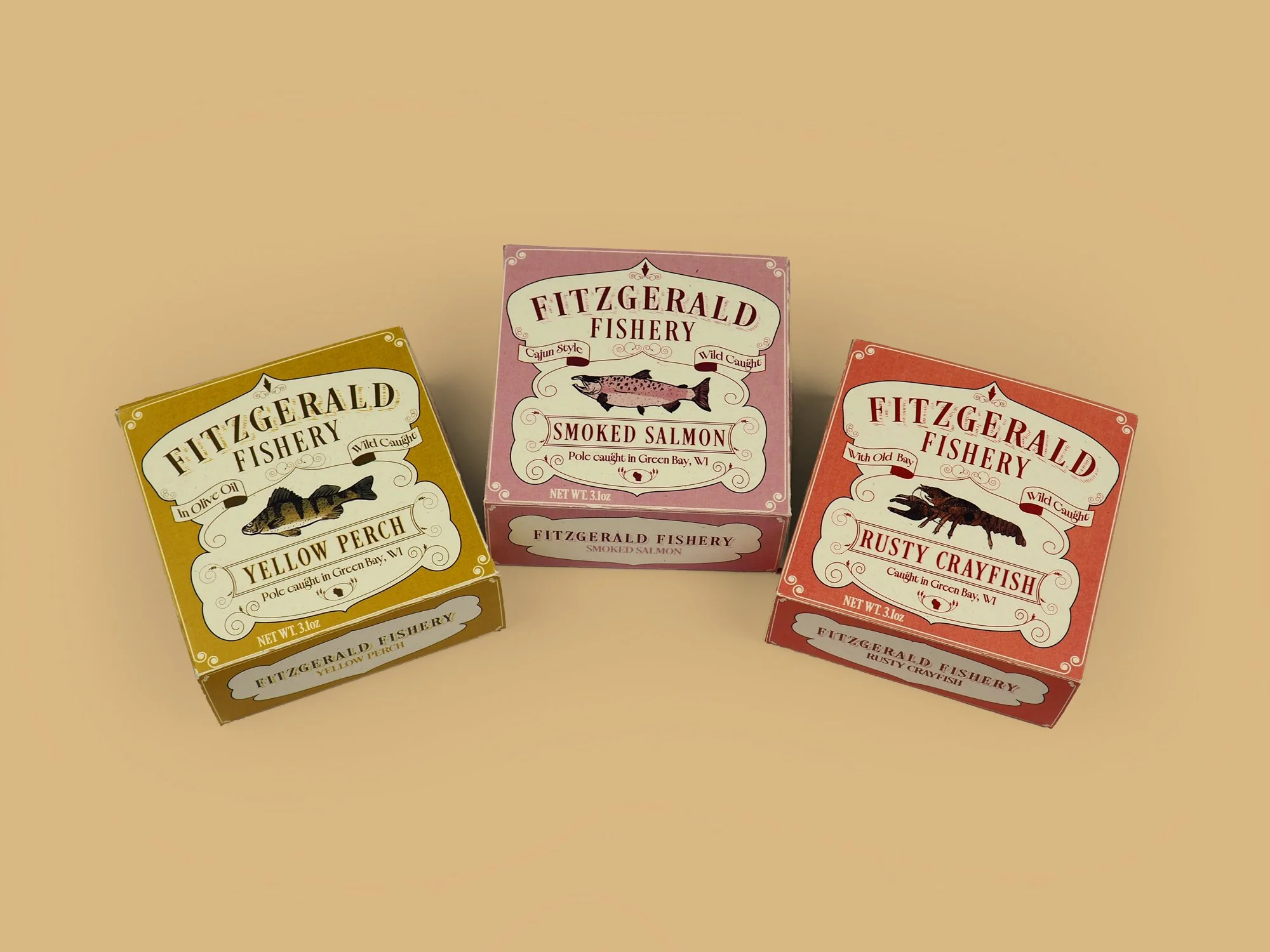 Three boxes of artisan smoked fish products in yellow, pink, and red packaging, displayed against a beige background.