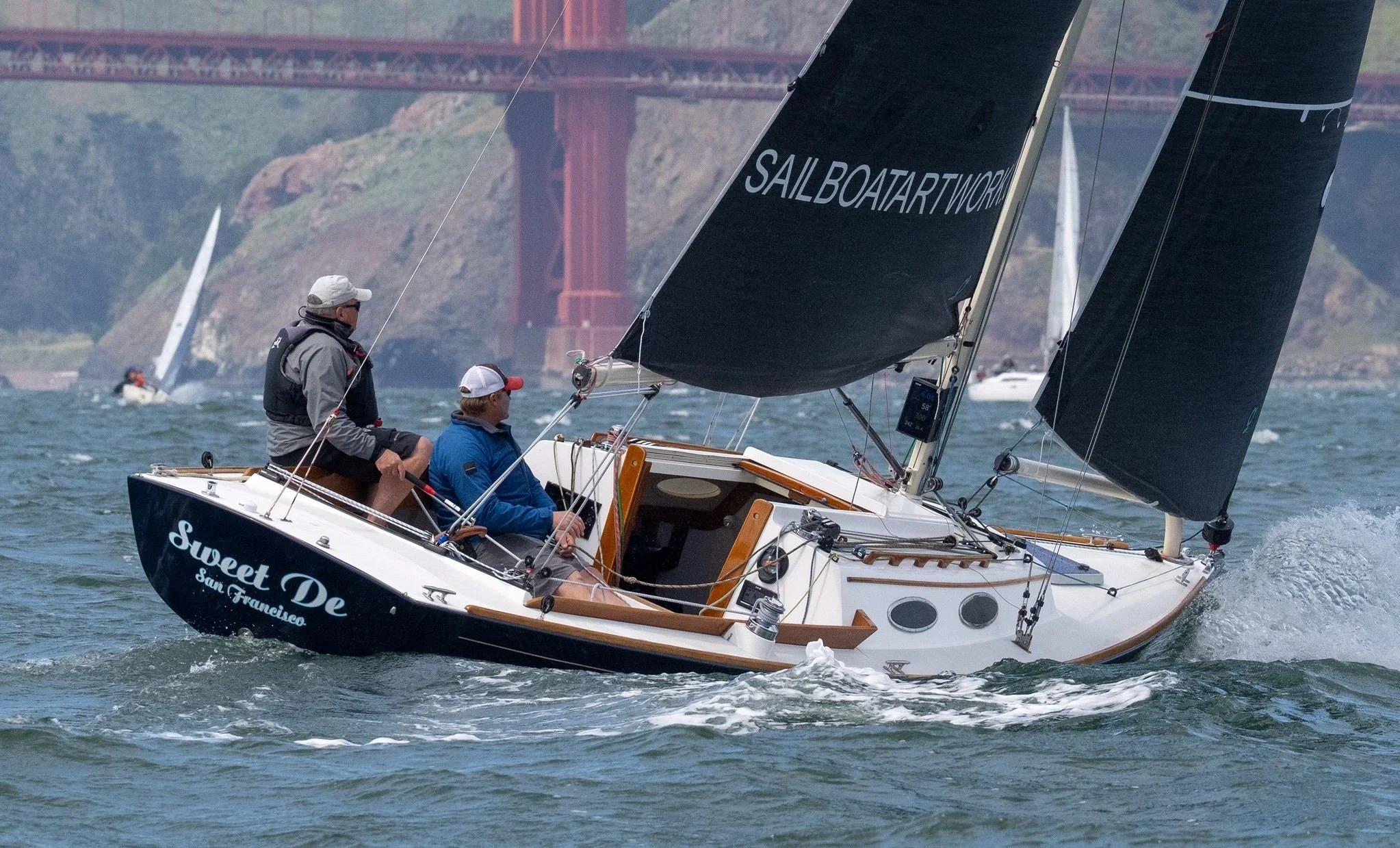 Alerion 28 named 'Sweet De' from San Francisco sailing  in front of the Golden Gate Bridge