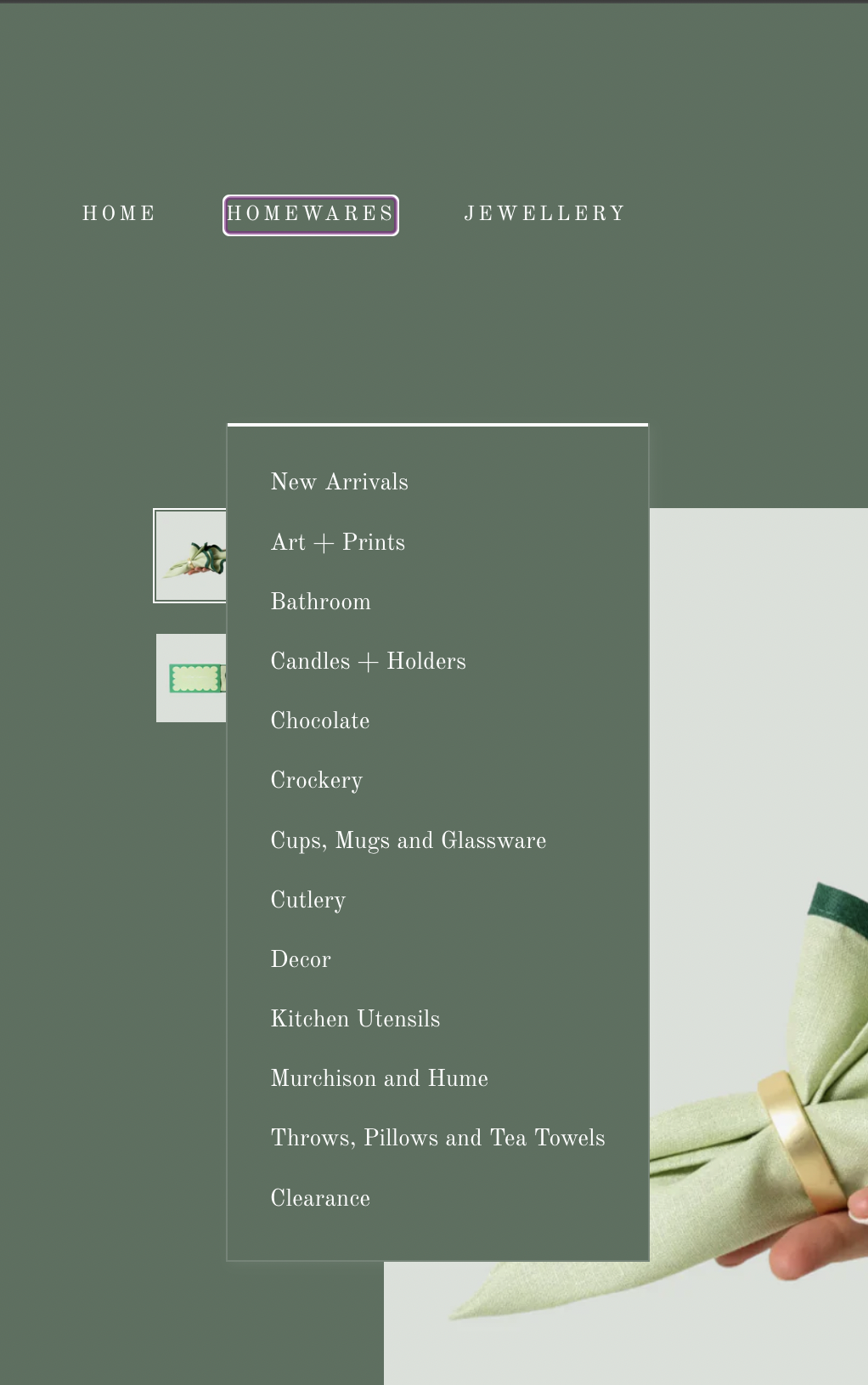 Part of a website menu for home decor and gift items, with categories including Home, Homewares, and Jewelry. The Homewares menu is highlighted, showing subcategories like New Arrivals, Art Prints, Bathroom, Candles Holders, Chocolate, Crockery, Cups