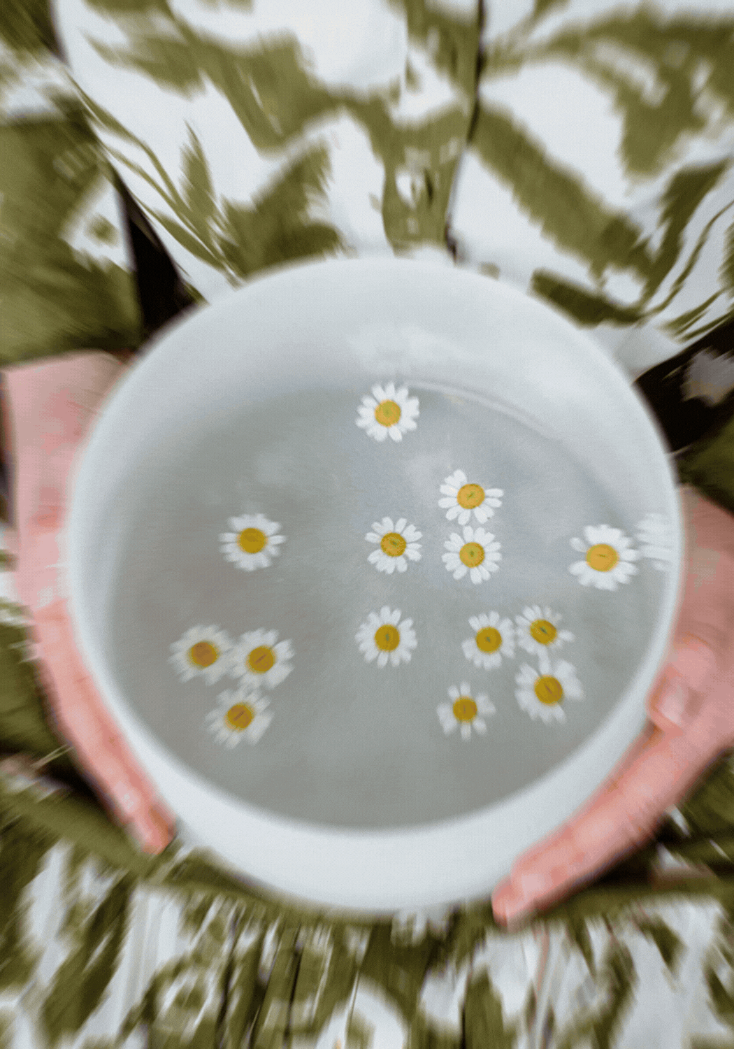 photo of therapist with singing bowl in lap with swirling flowers, followed by a photo of Laura standing in front of styled decor and plant in a warm office setting