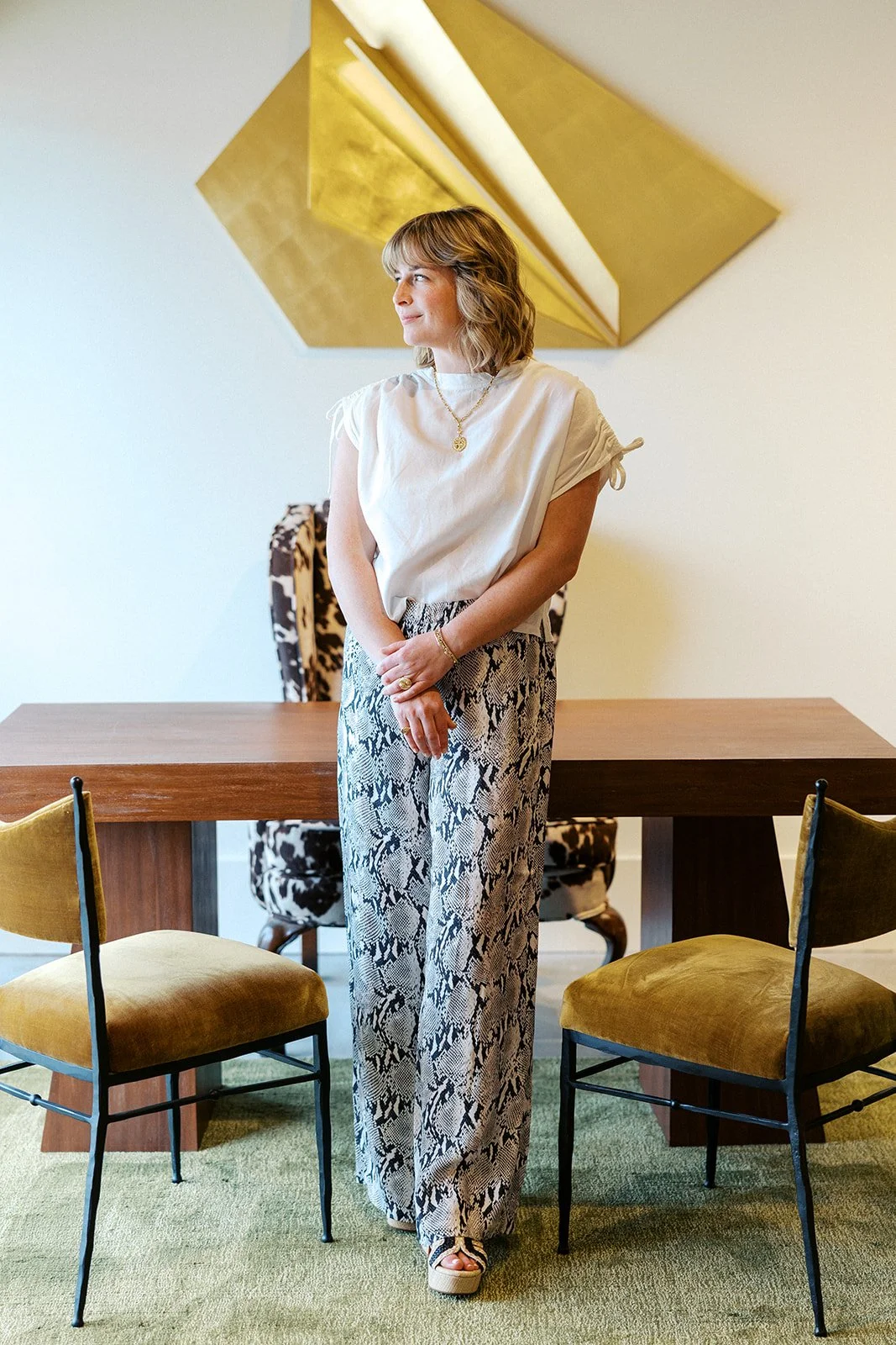 Laura standing in front of office desk