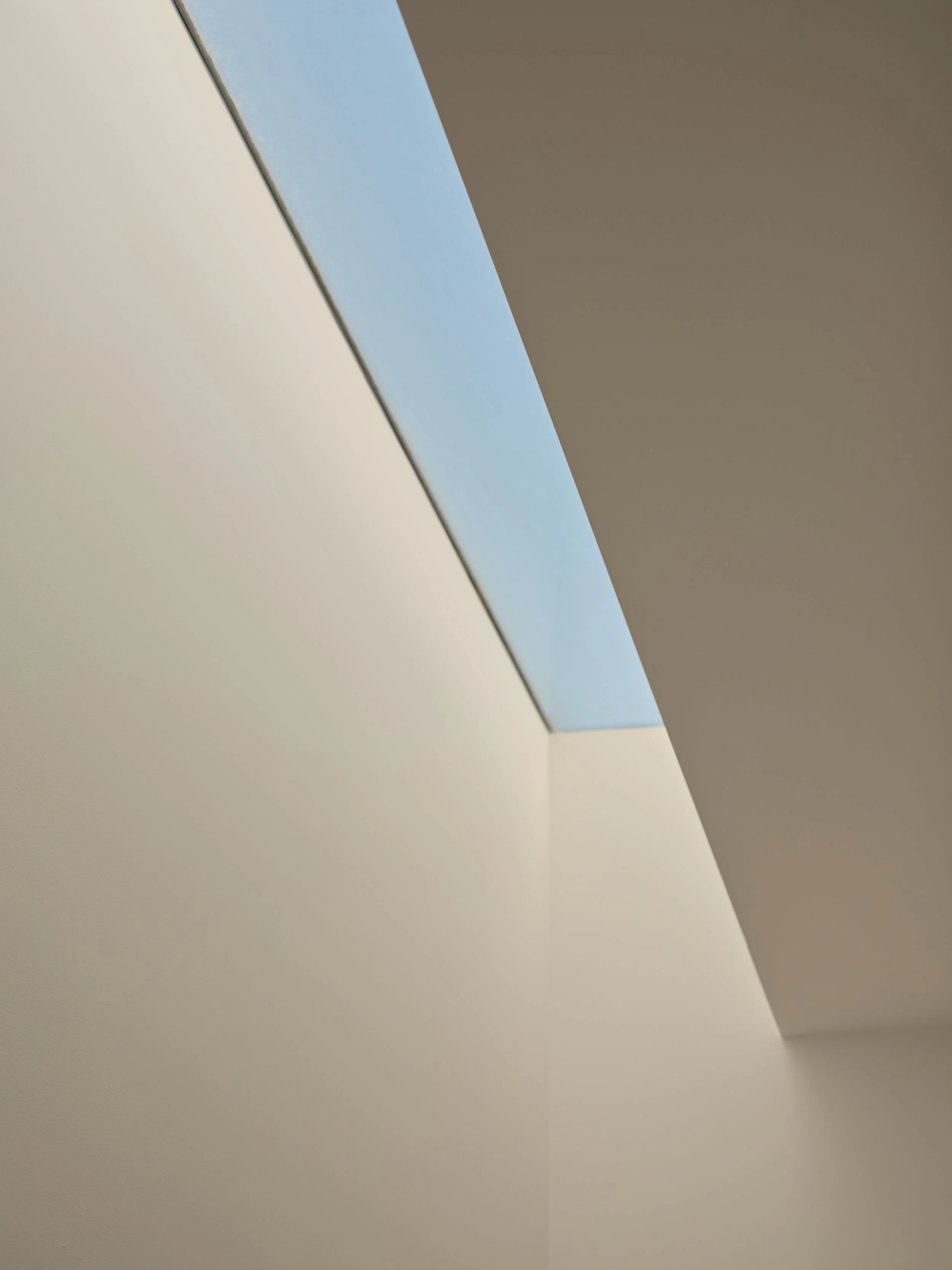 Close-up of a loft or skylight opening with natural light coming through.