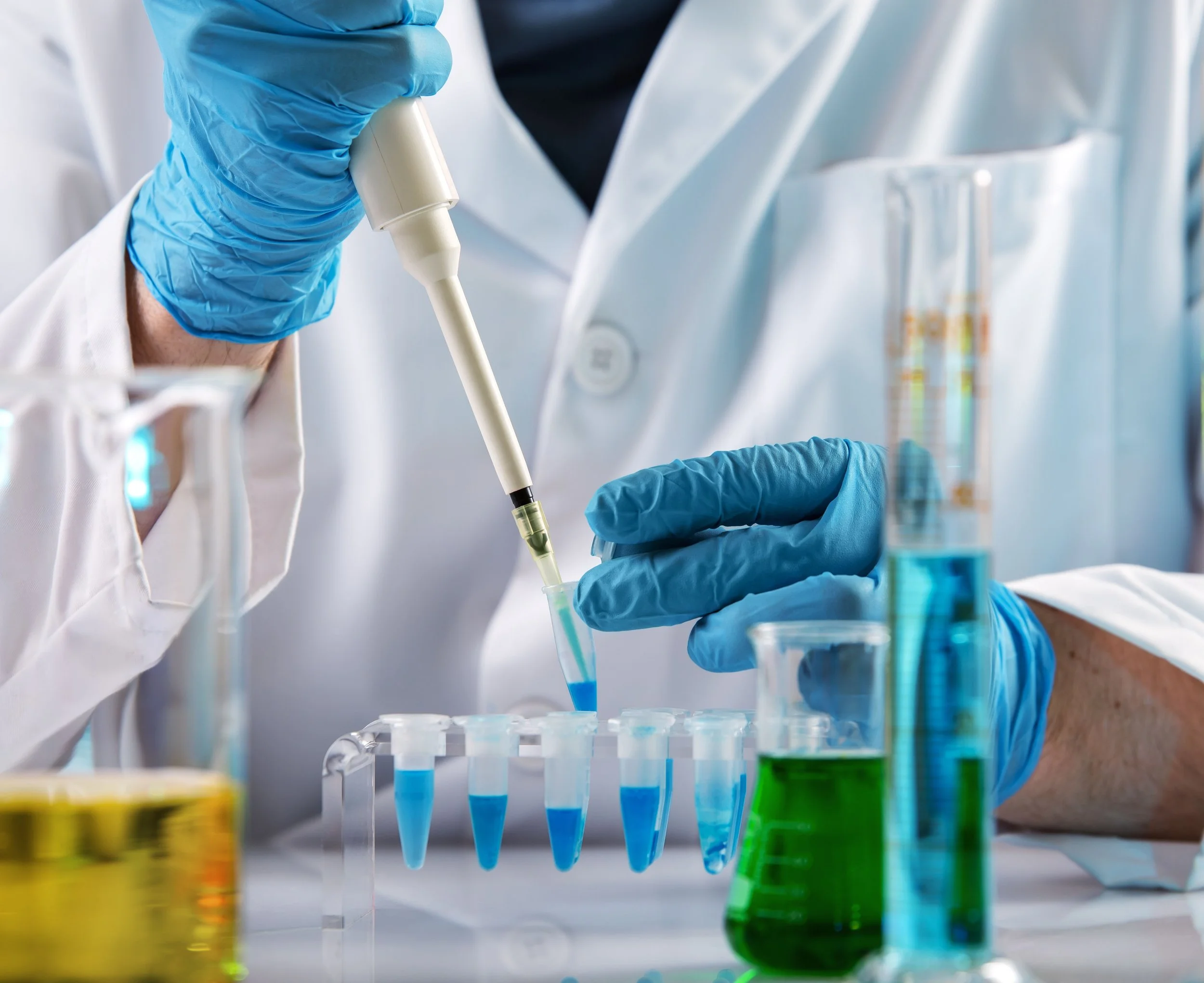 Closeup of Lab technician using test tubes