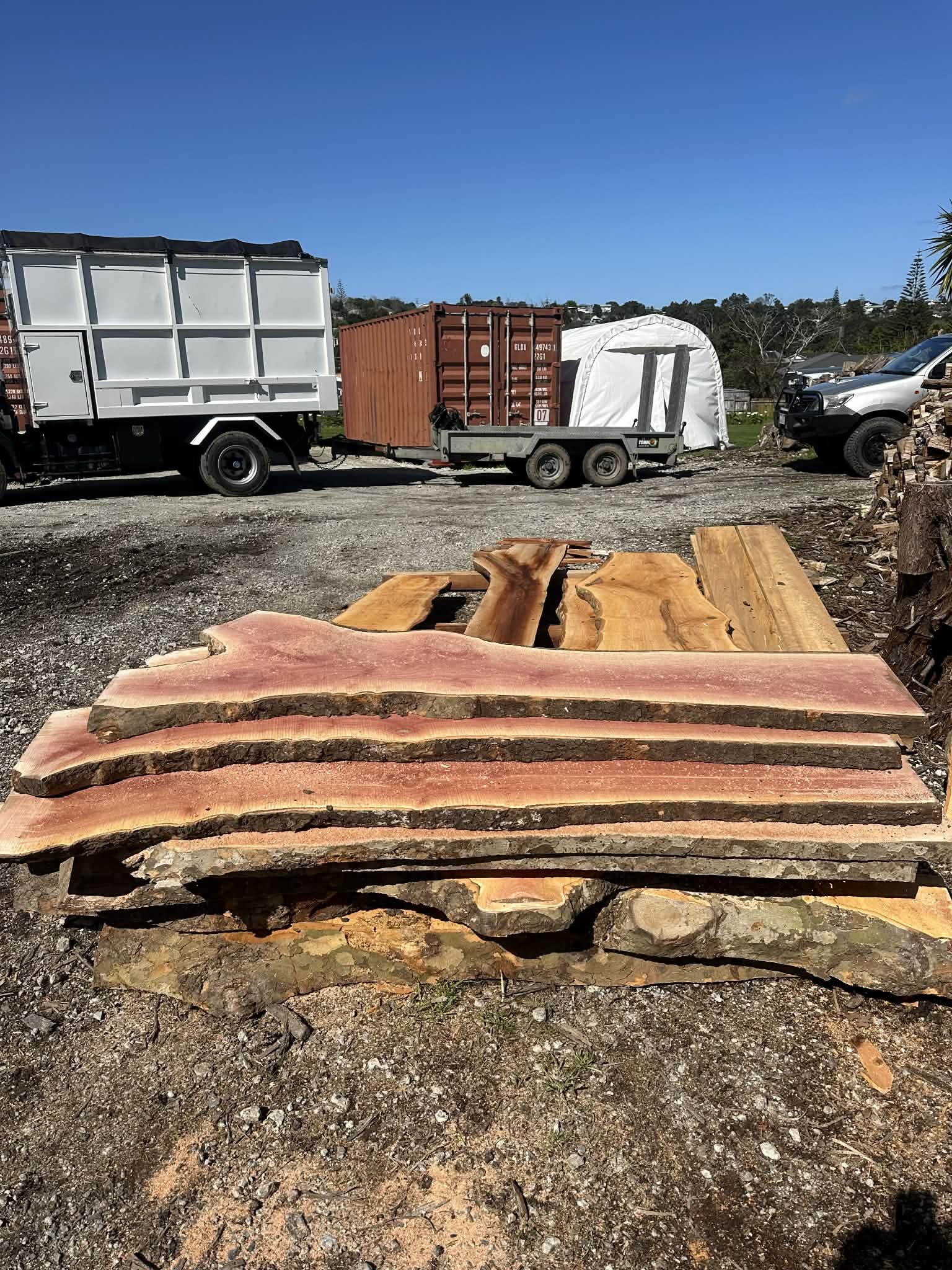 stacked slabs of freshly milled timber