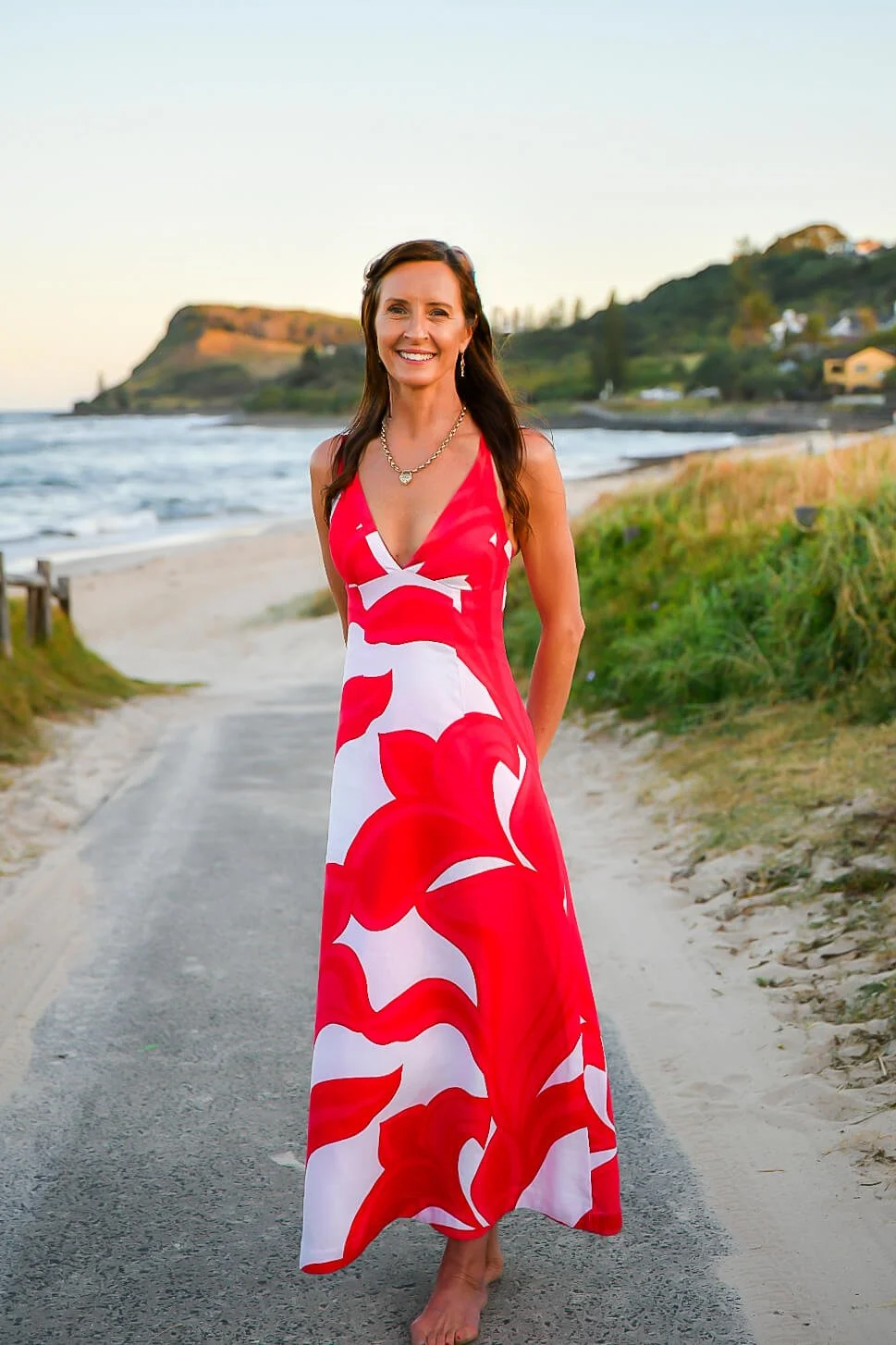 Lesley Amato, founder of Rose Bee Digital, standing on a beach in Lennox Head in the Northern Rivers region.