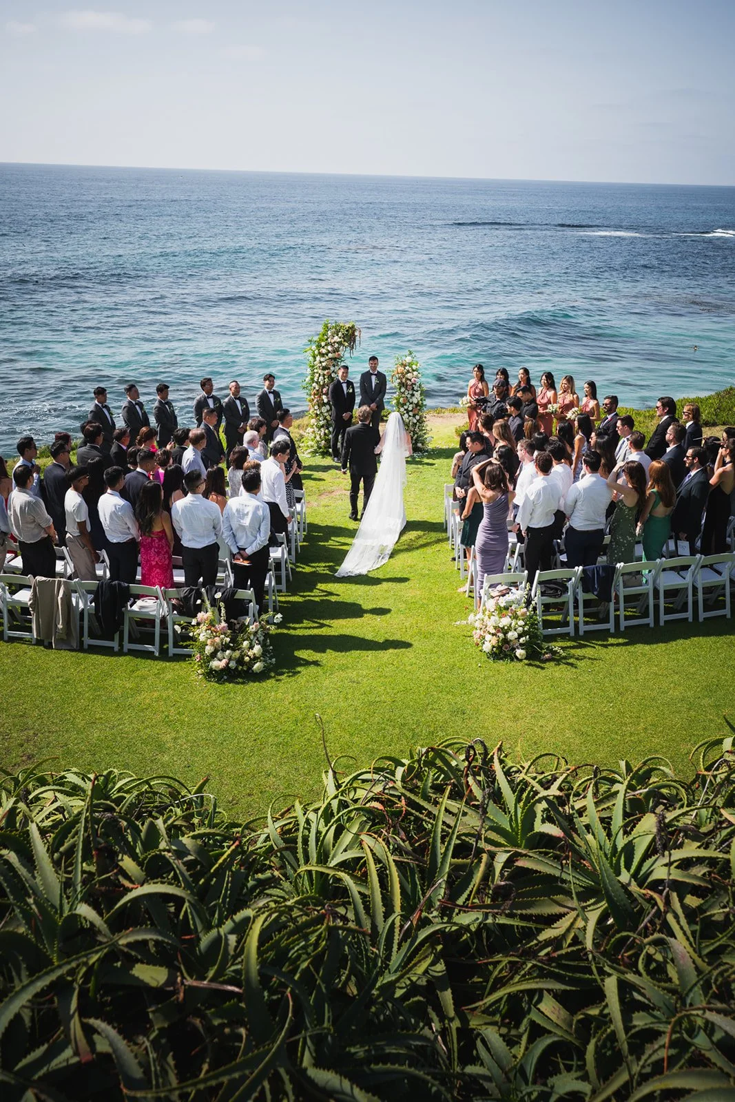 wedding ceremony taking place overlooking the Pacific Ocean in San Diego, California