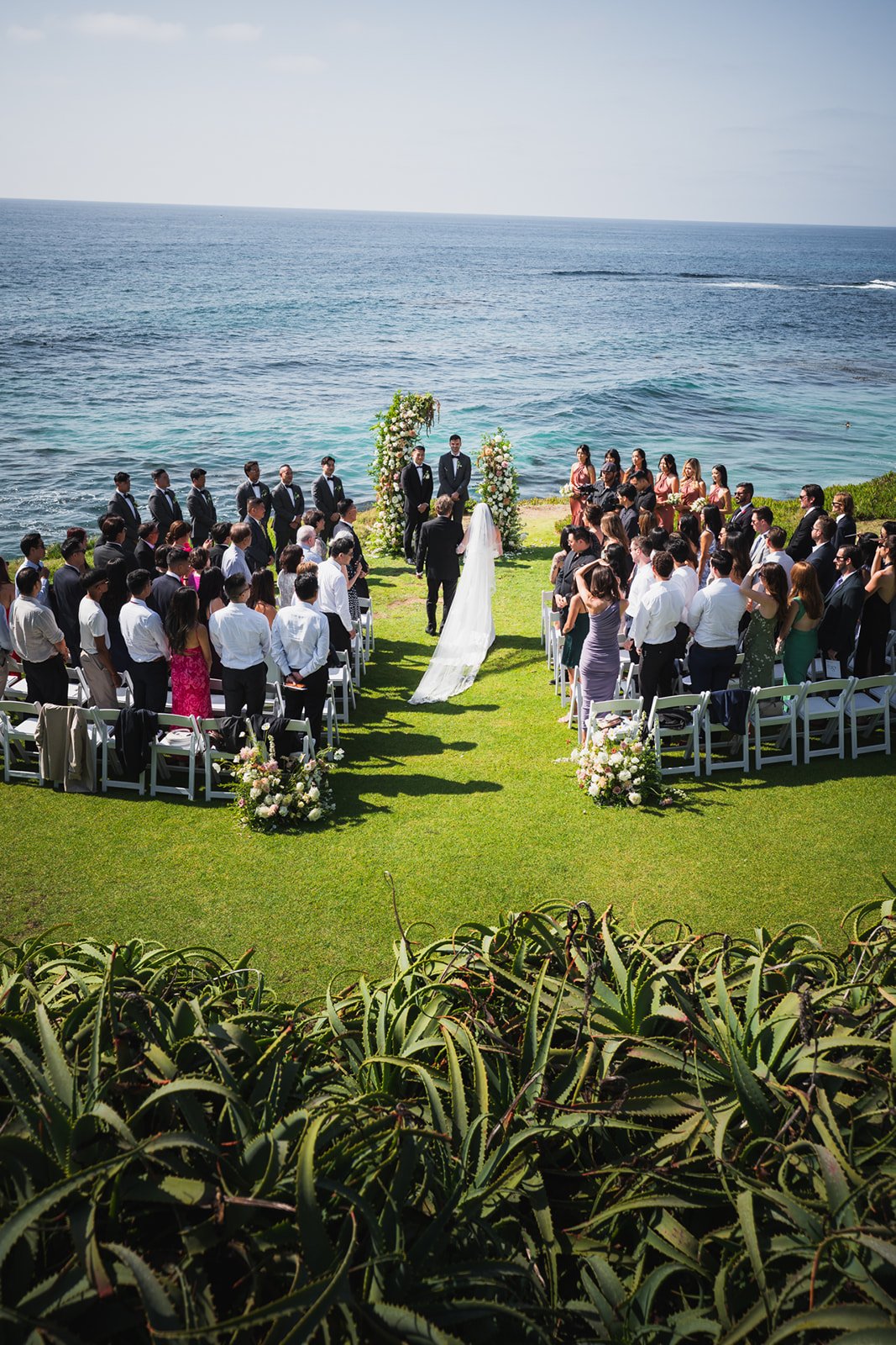 wedding ceremony taking place overlooking the Pacific Ocean in San Diego, California